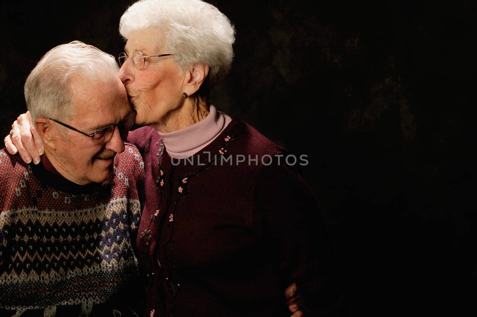 Woman kisses man