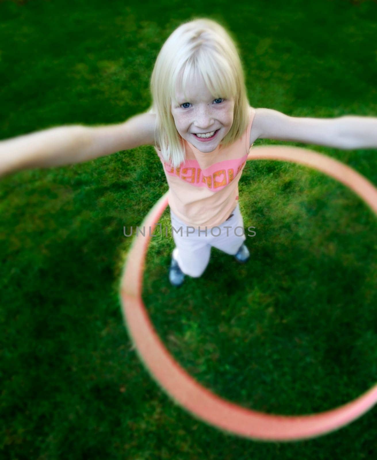 Child plays with hoop
