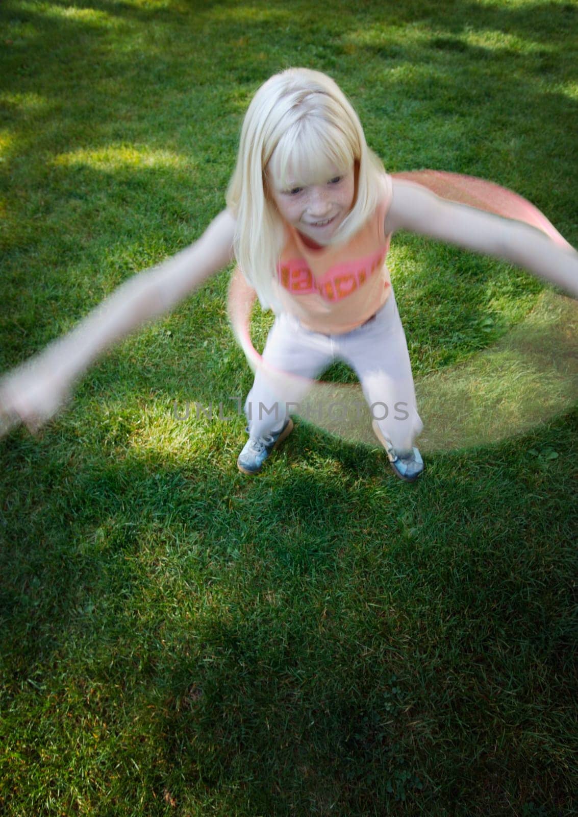 Child plays with hoop