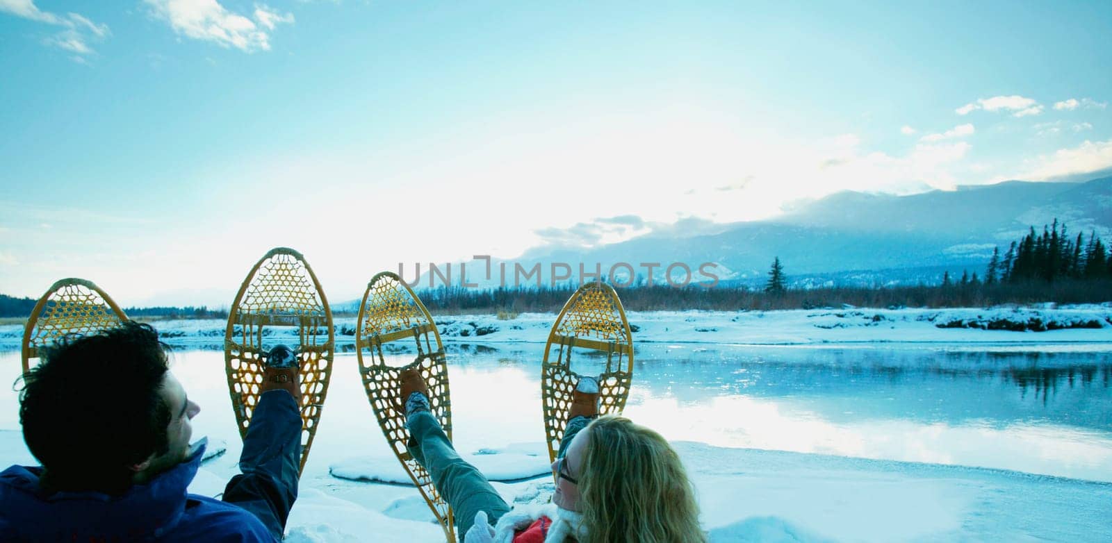 A couple with snowshoes