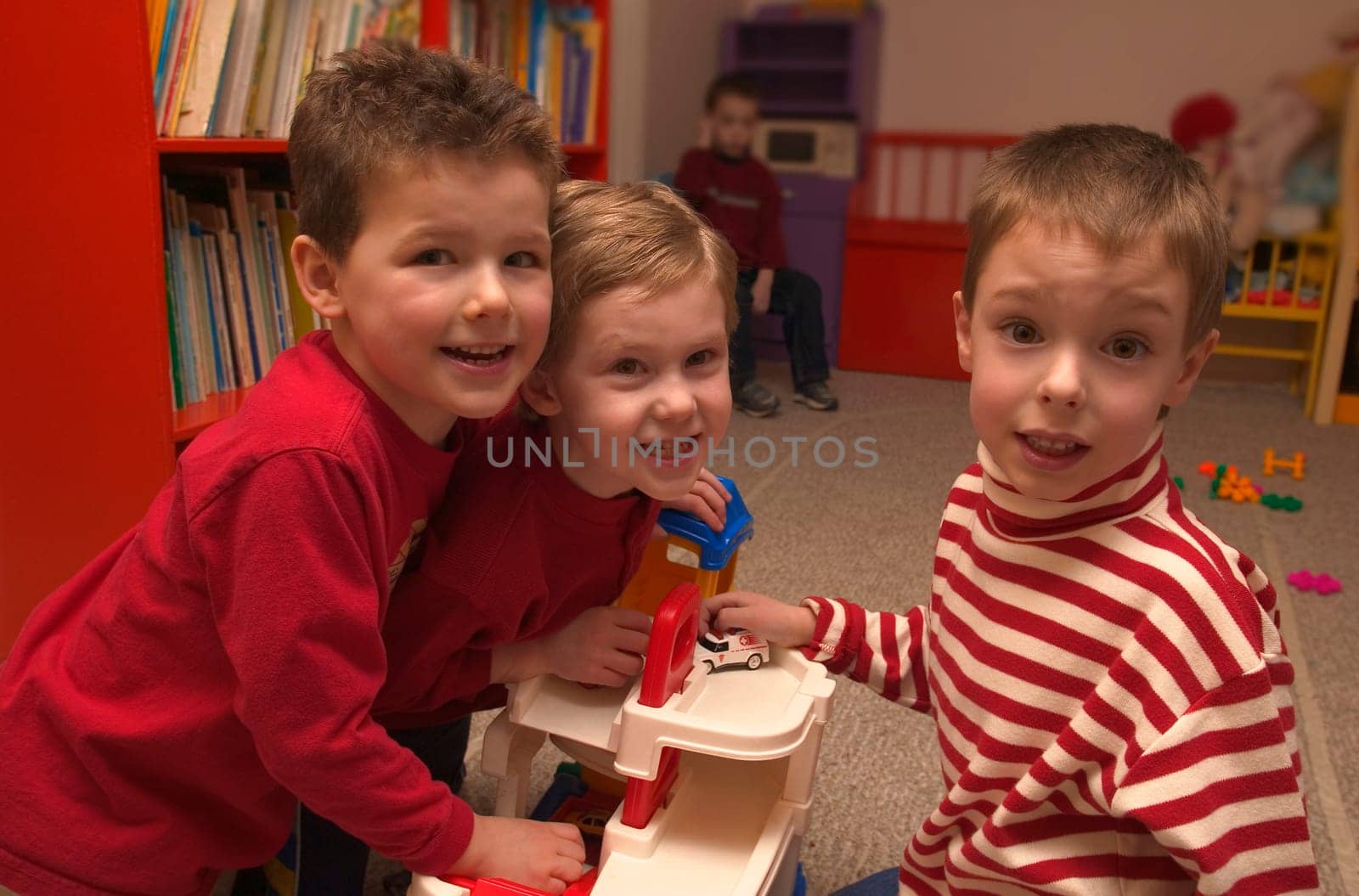 Three boys playing together at preschool
