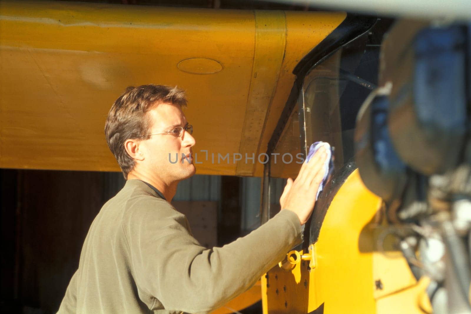 Pilot with his airplane