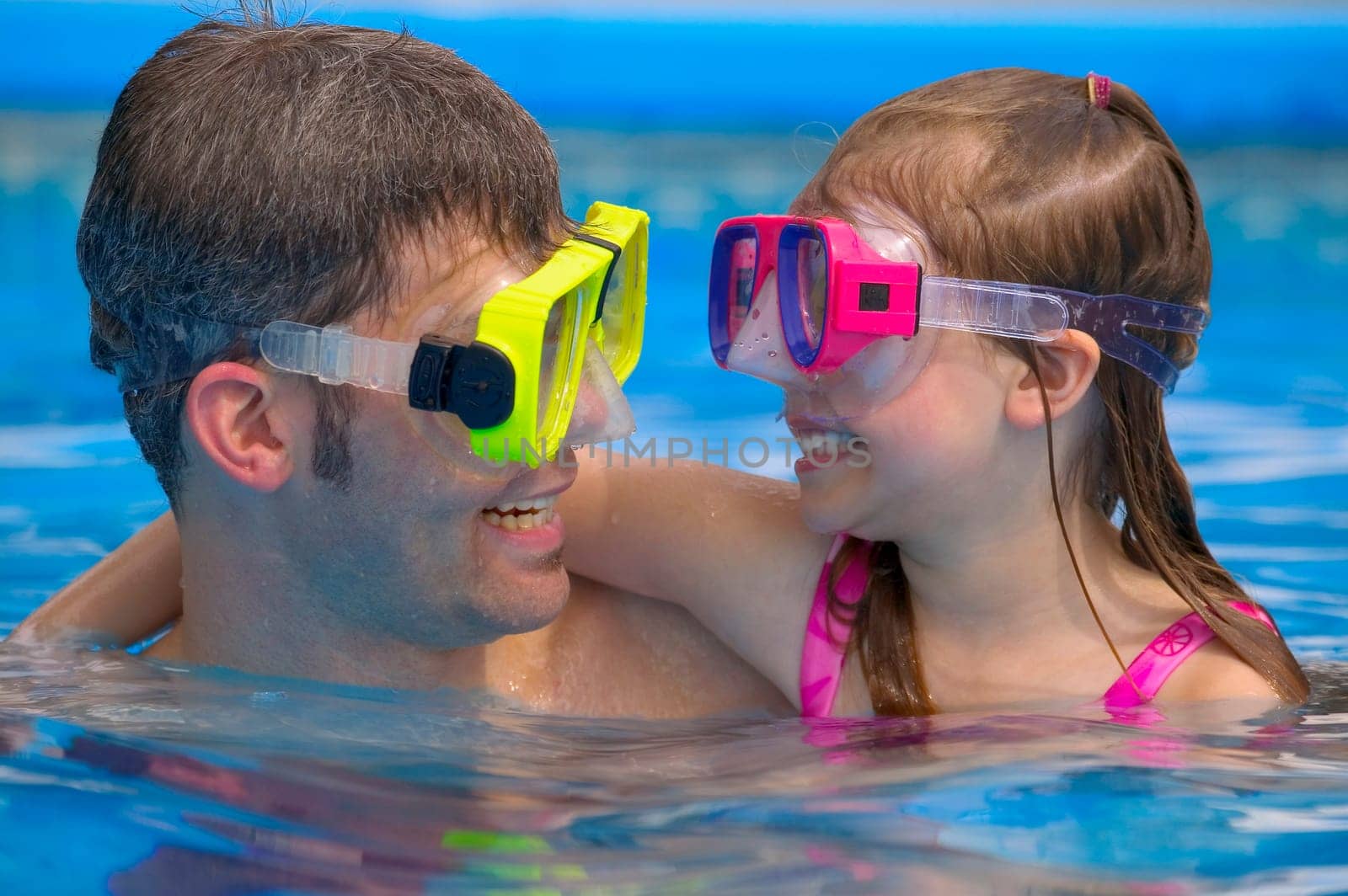 Portrait of father and daughter snorkeling