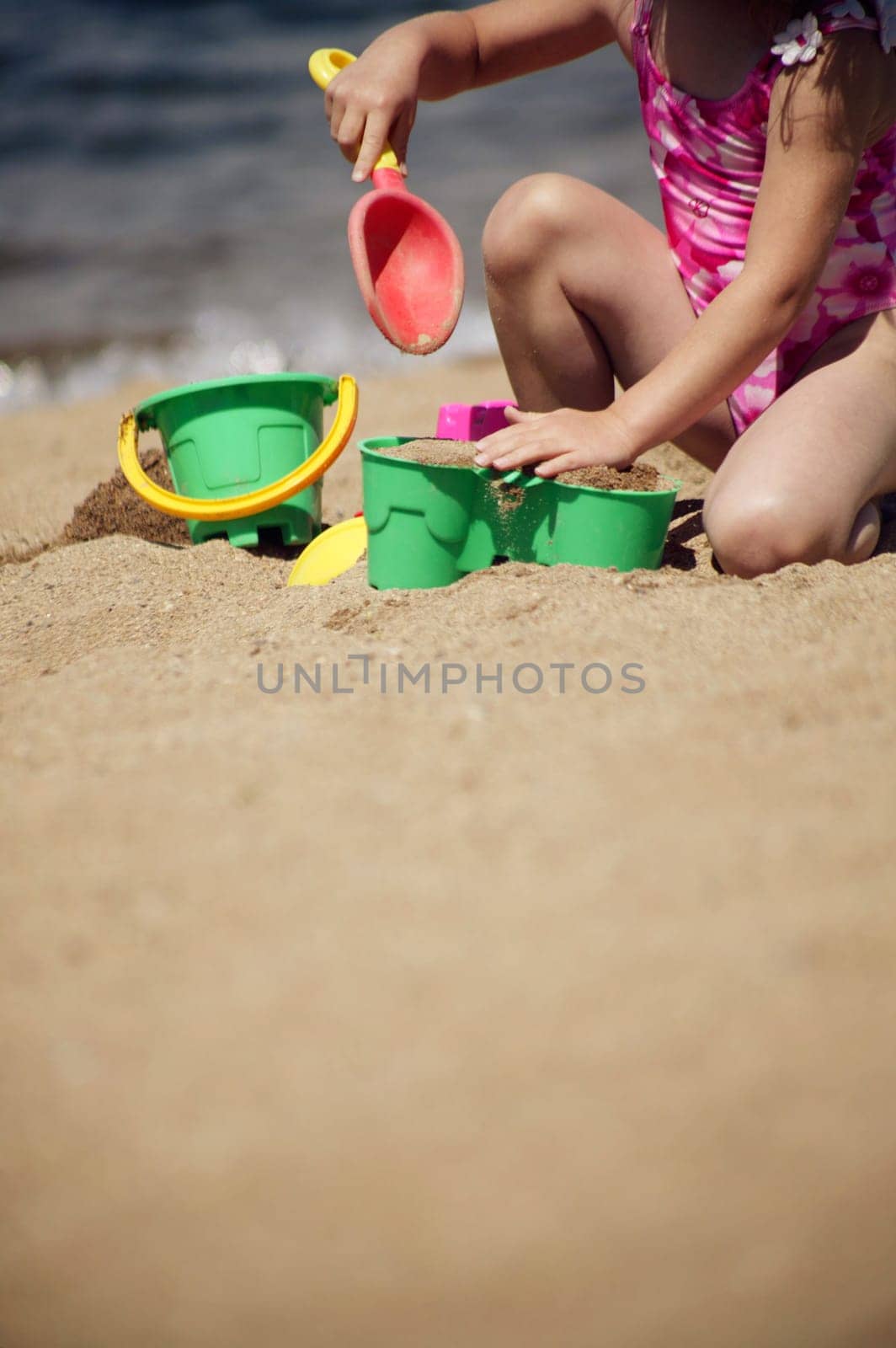 Child playing in the sand