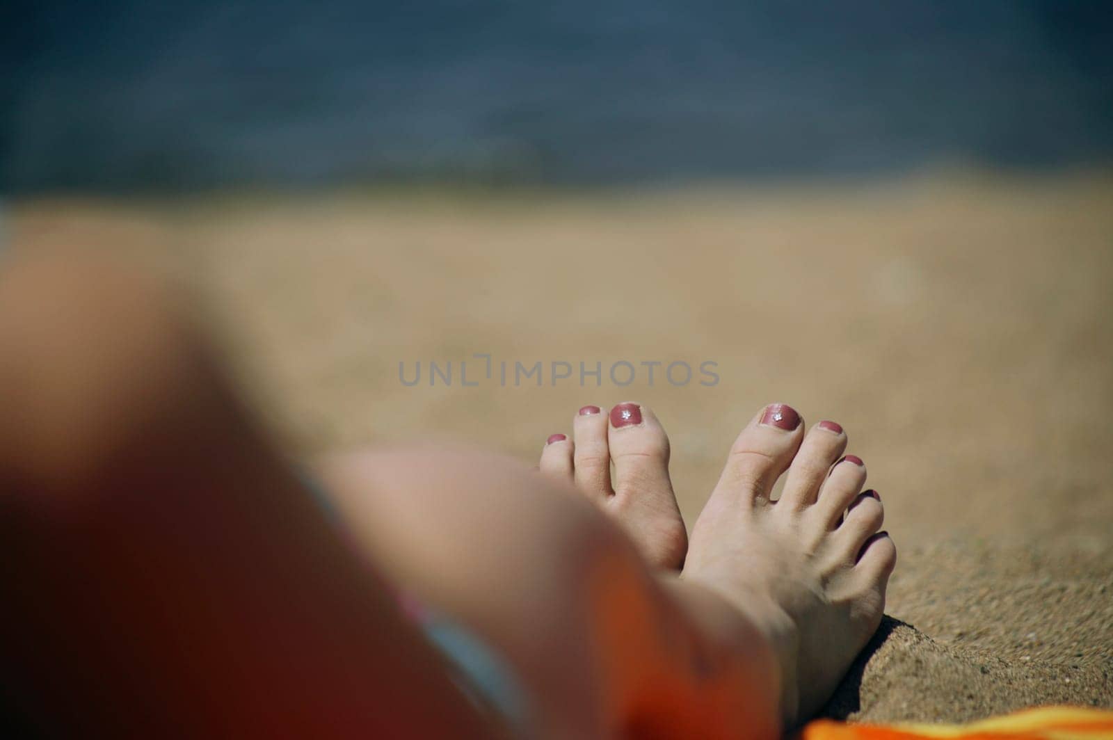 A woman's feet on a beach