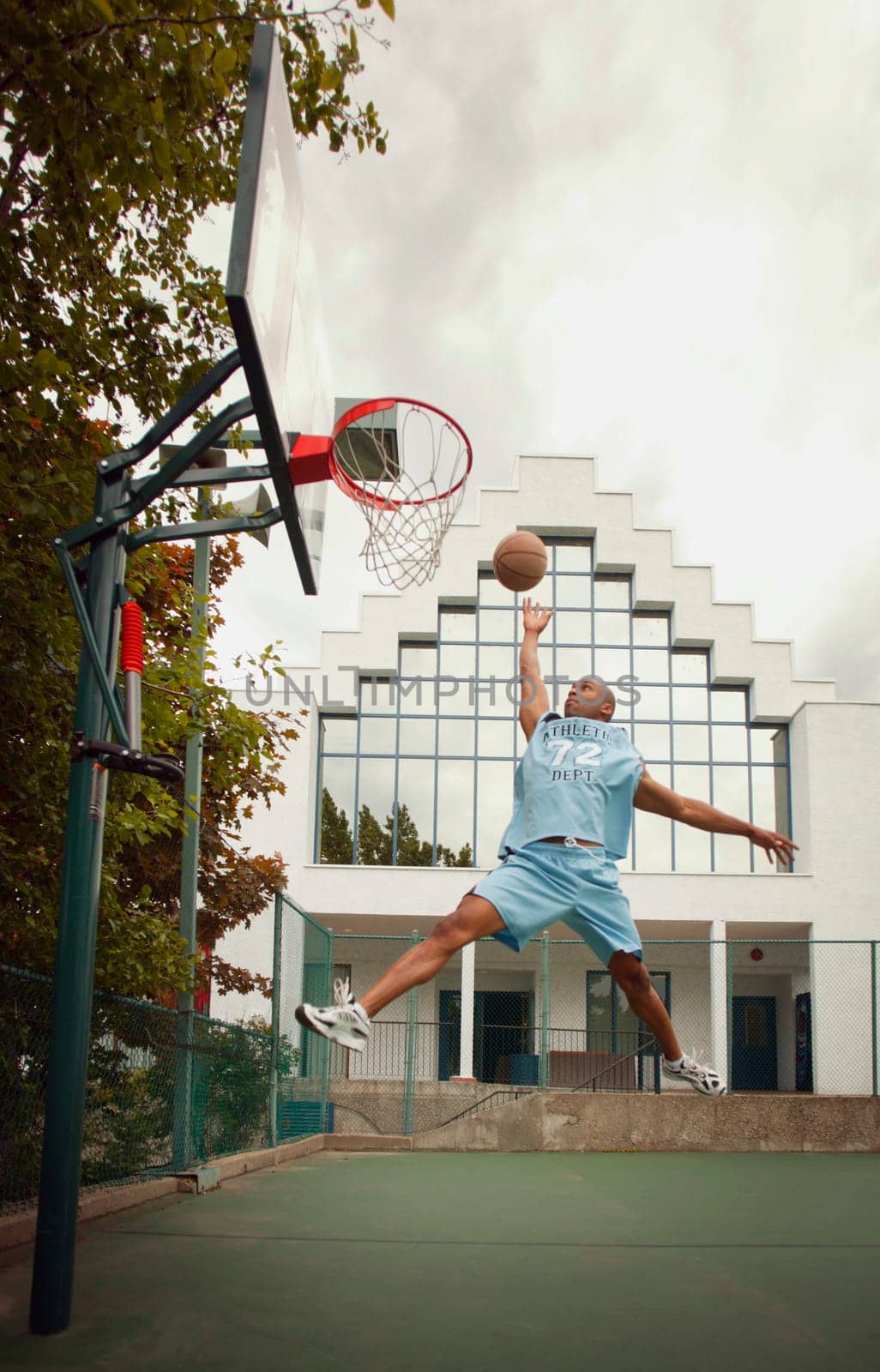Man plays basketball