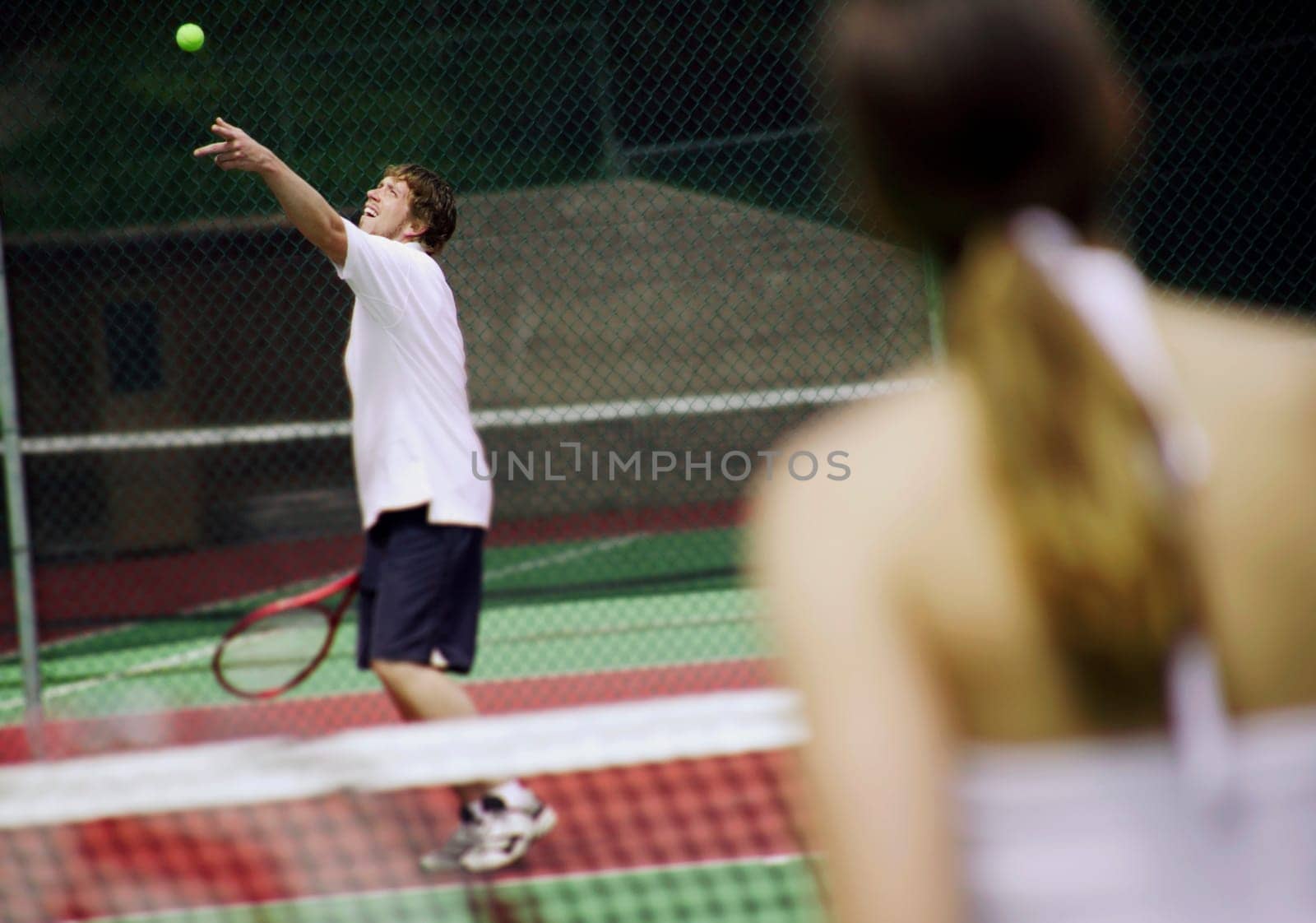 A couple playing tennis