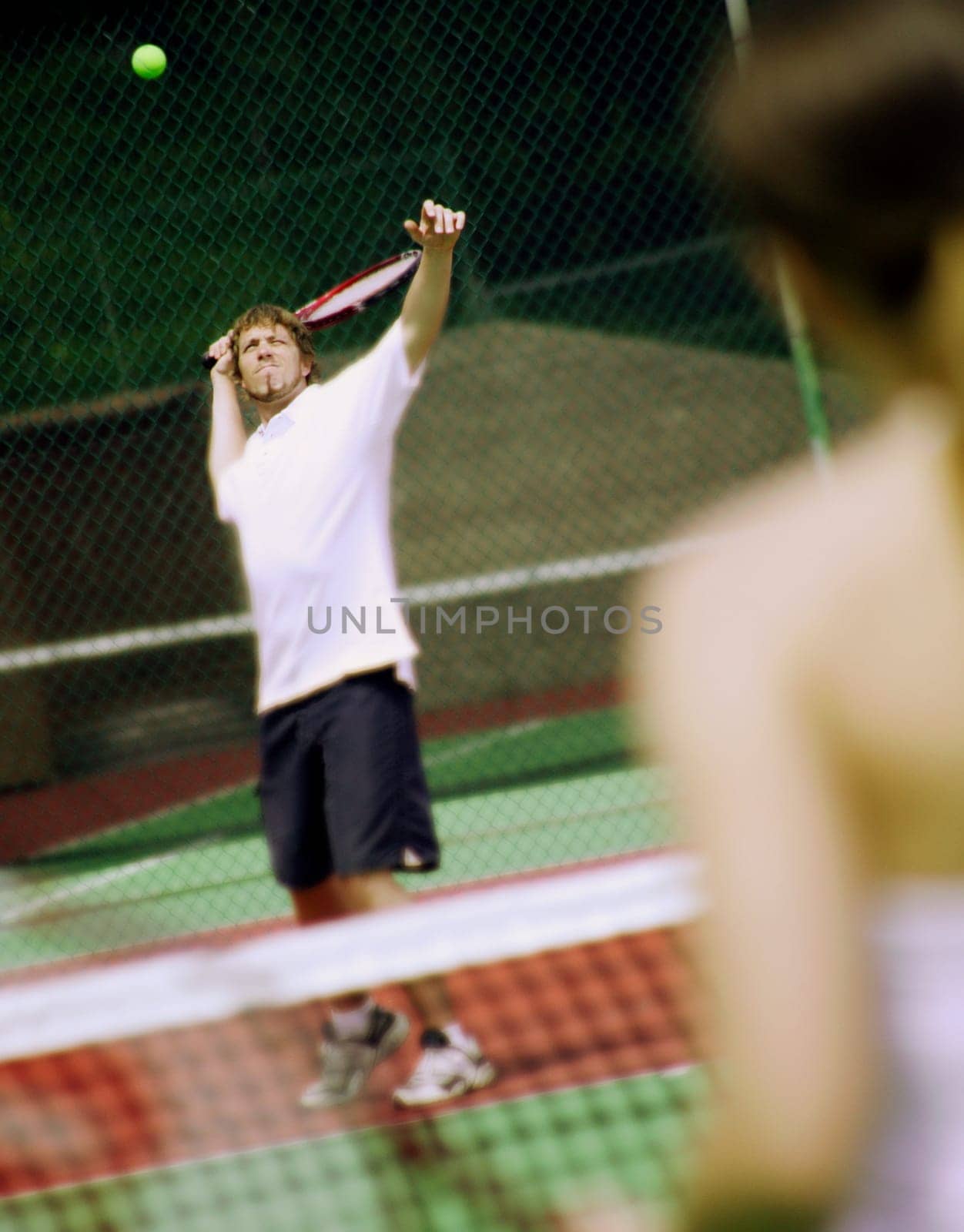 A couple playing tennis