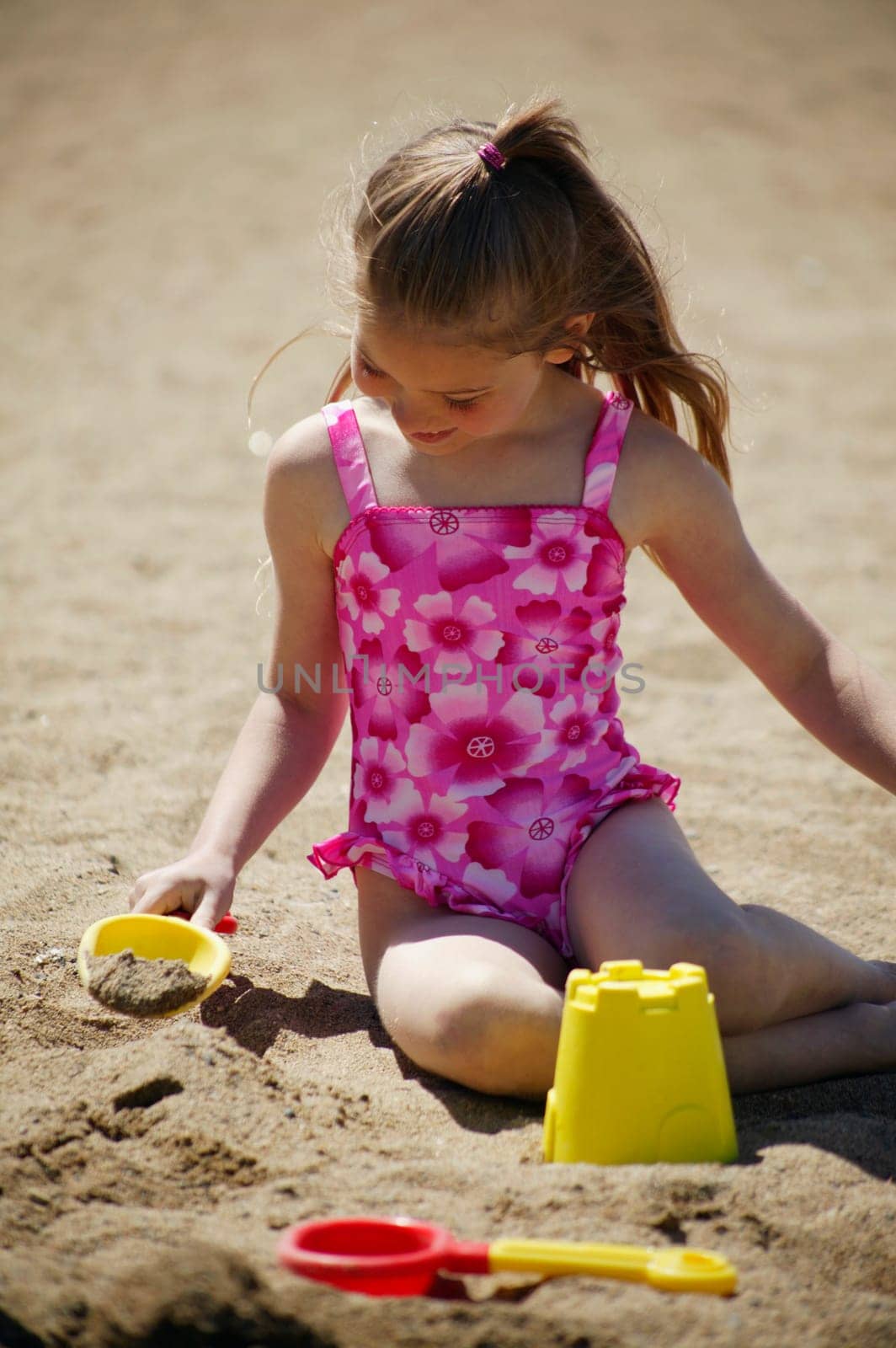 Child playing in the sand