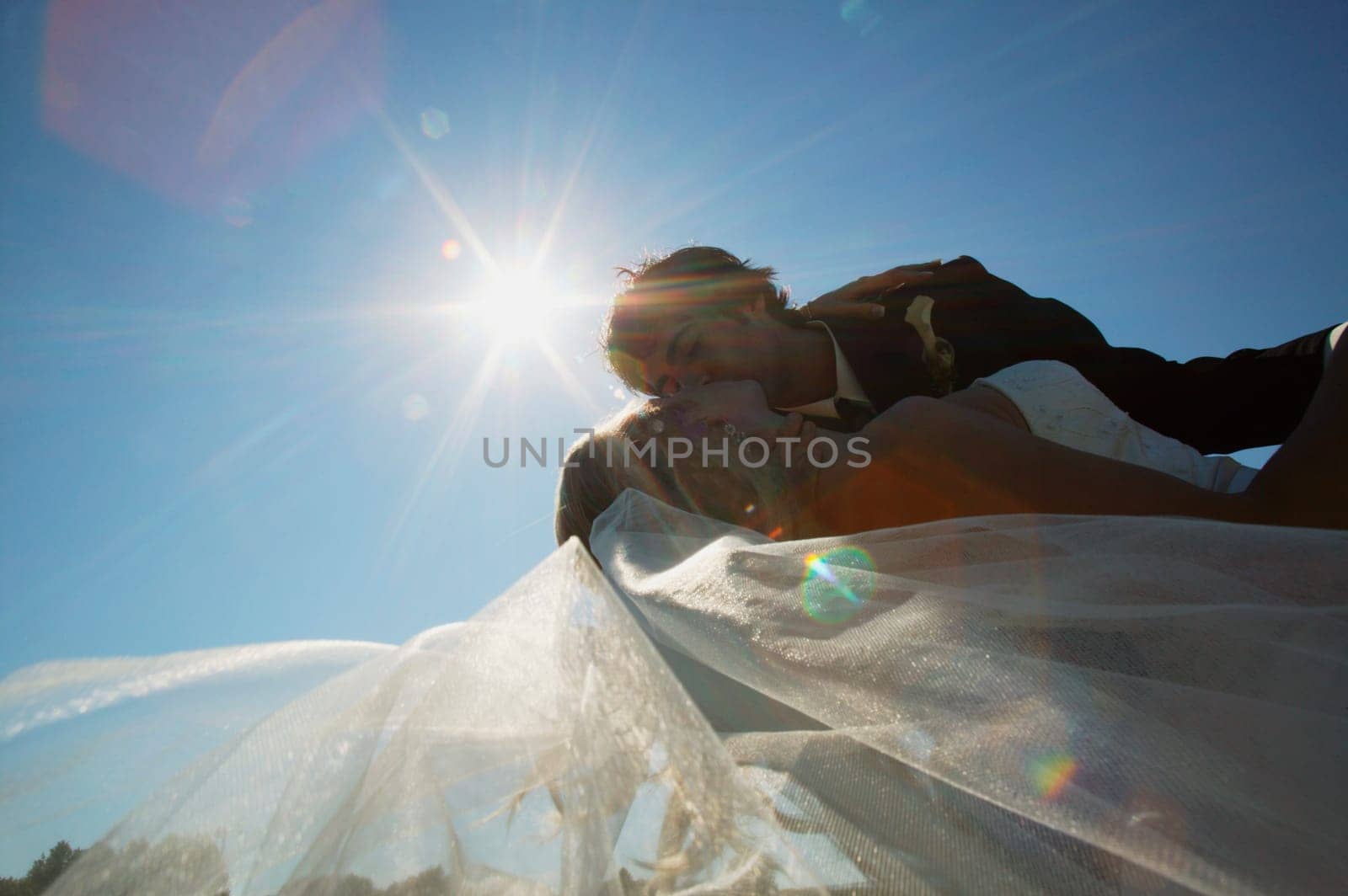 A bride and groom kiss