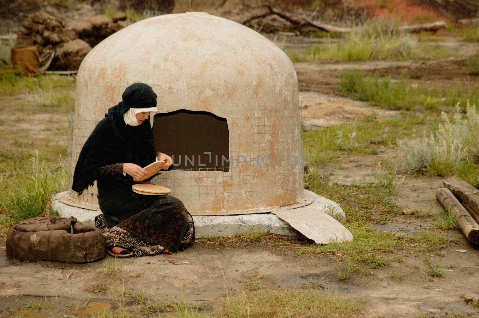 Woman wearing black bakes bread