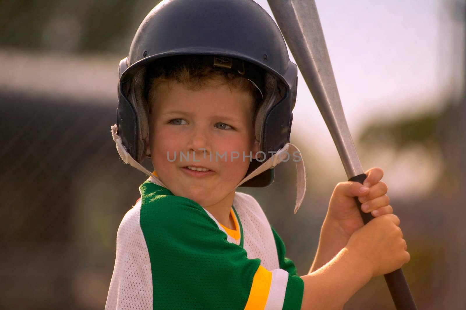 Portrait of Boy Wearing Baseball Uniform and Helmet Holding Bat