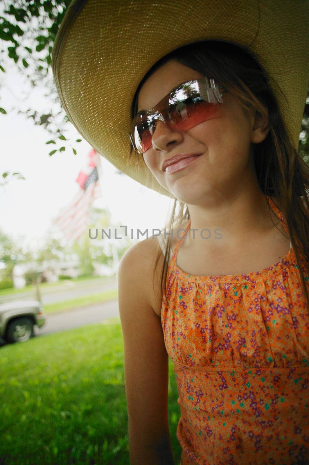 Teen with a hat and sunglasses