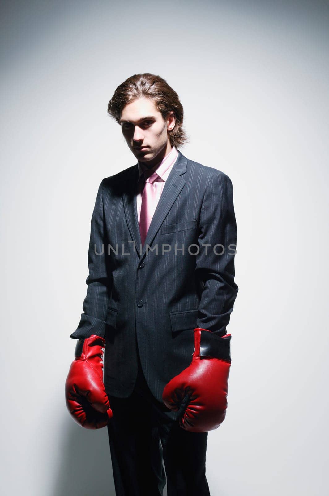 Businessman with fighting gloves