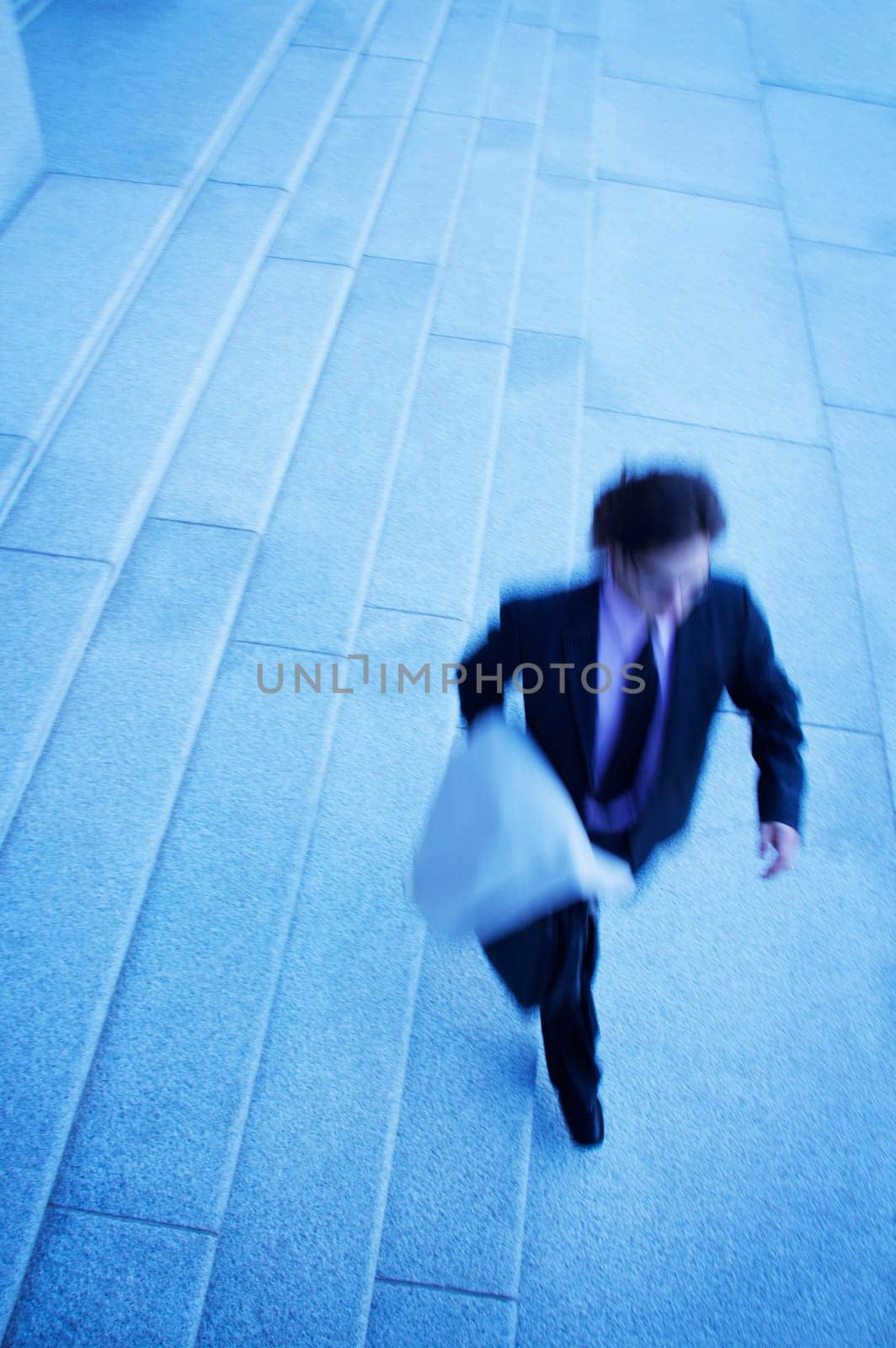 Businessman walks quickly