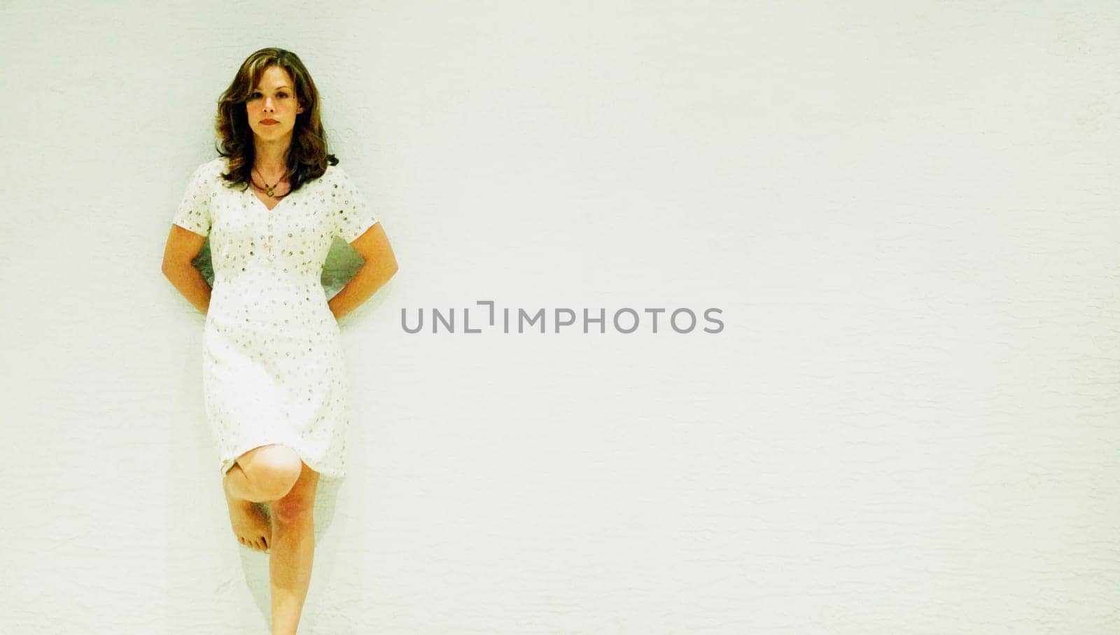 Portrait of a woman in a white dress