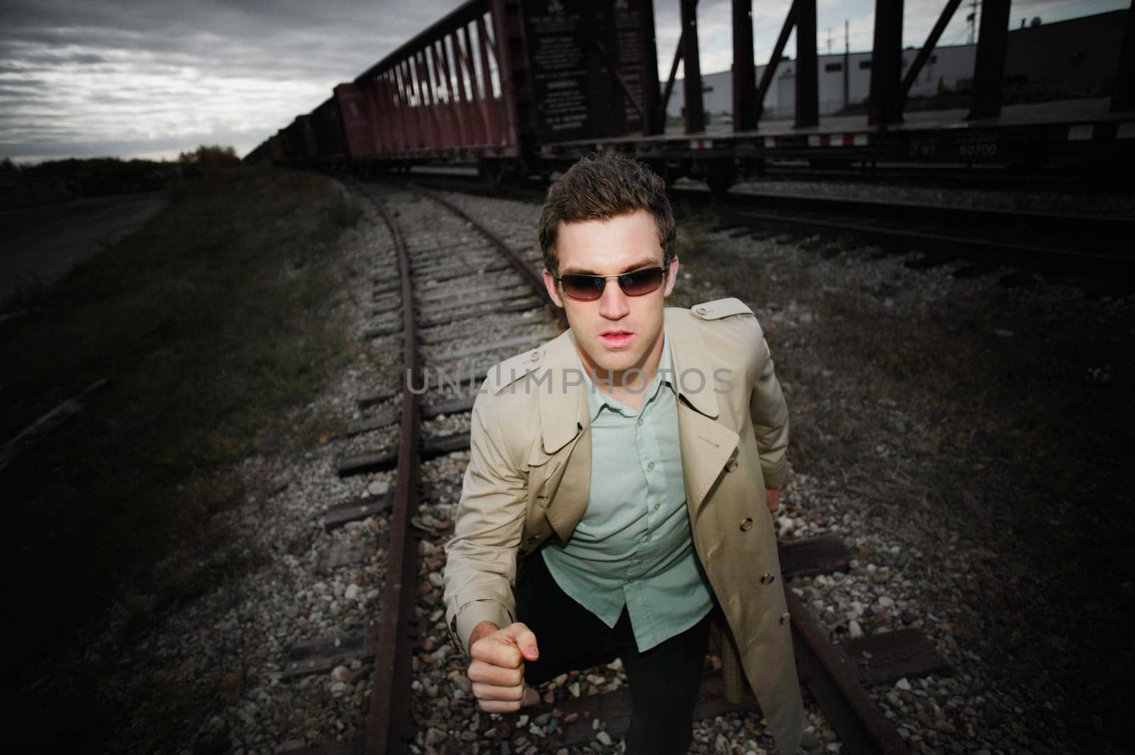 Man runs alongside a train