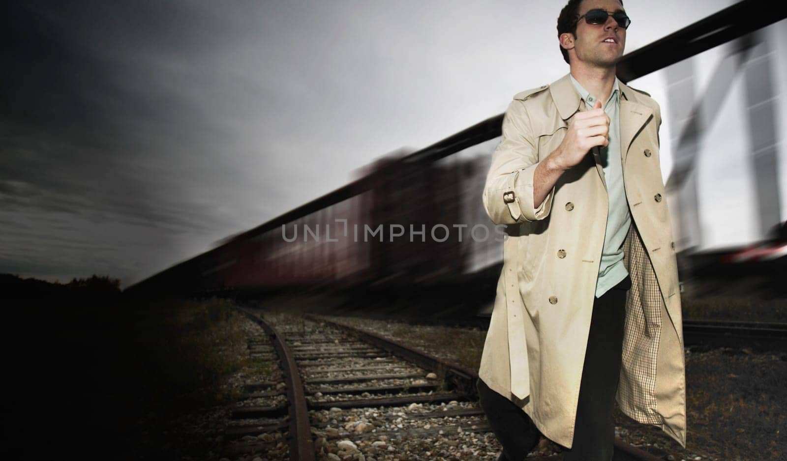 Man runs alongside a train