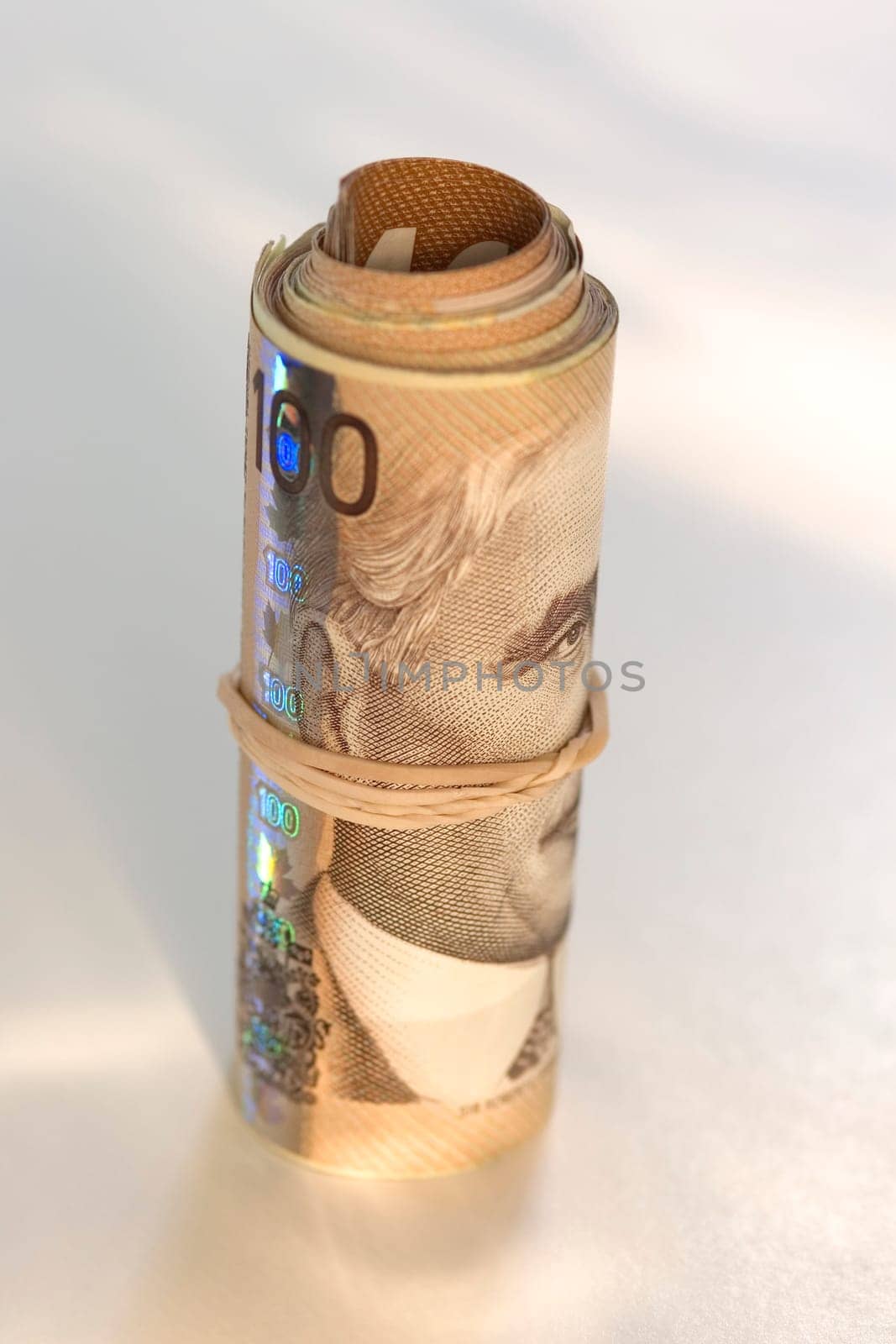 Roll of Canadian one hundred dollar bills