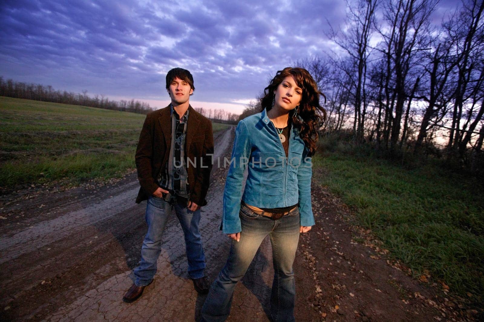Young trendy man and woman outside