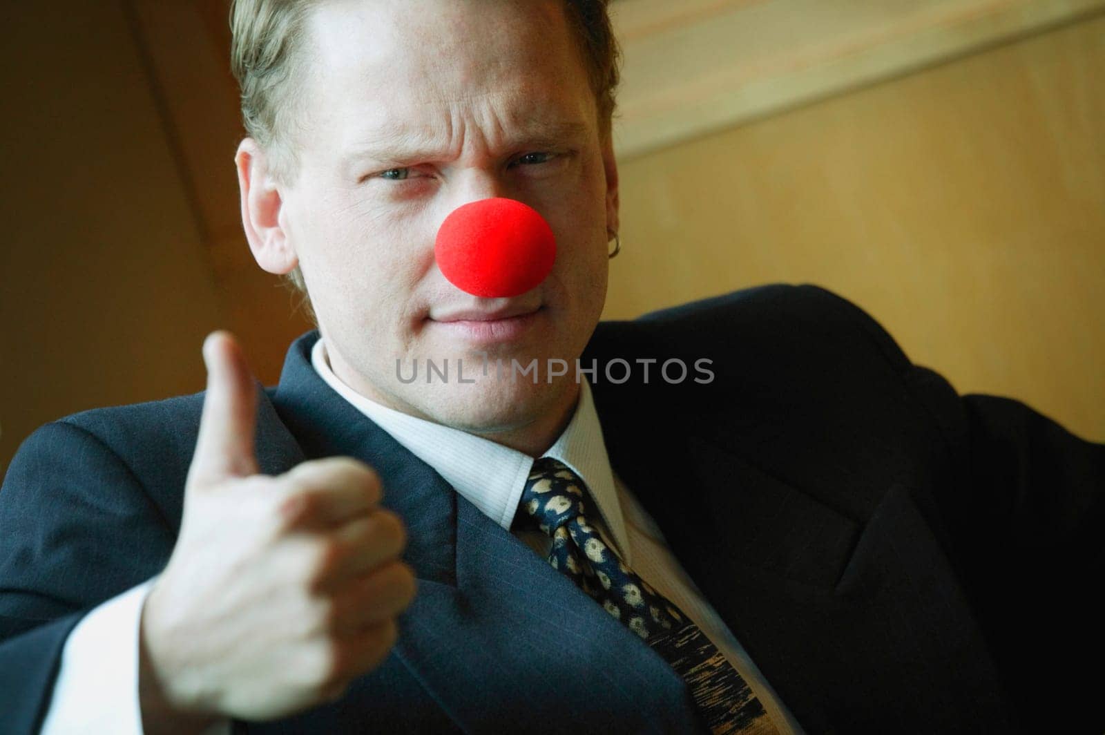 Businessman wearing clowning around