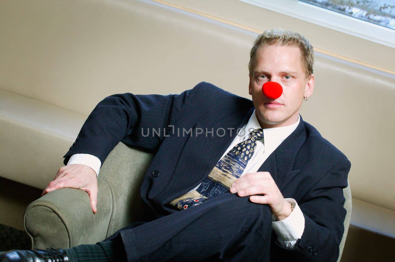 Businessman wearing red nose