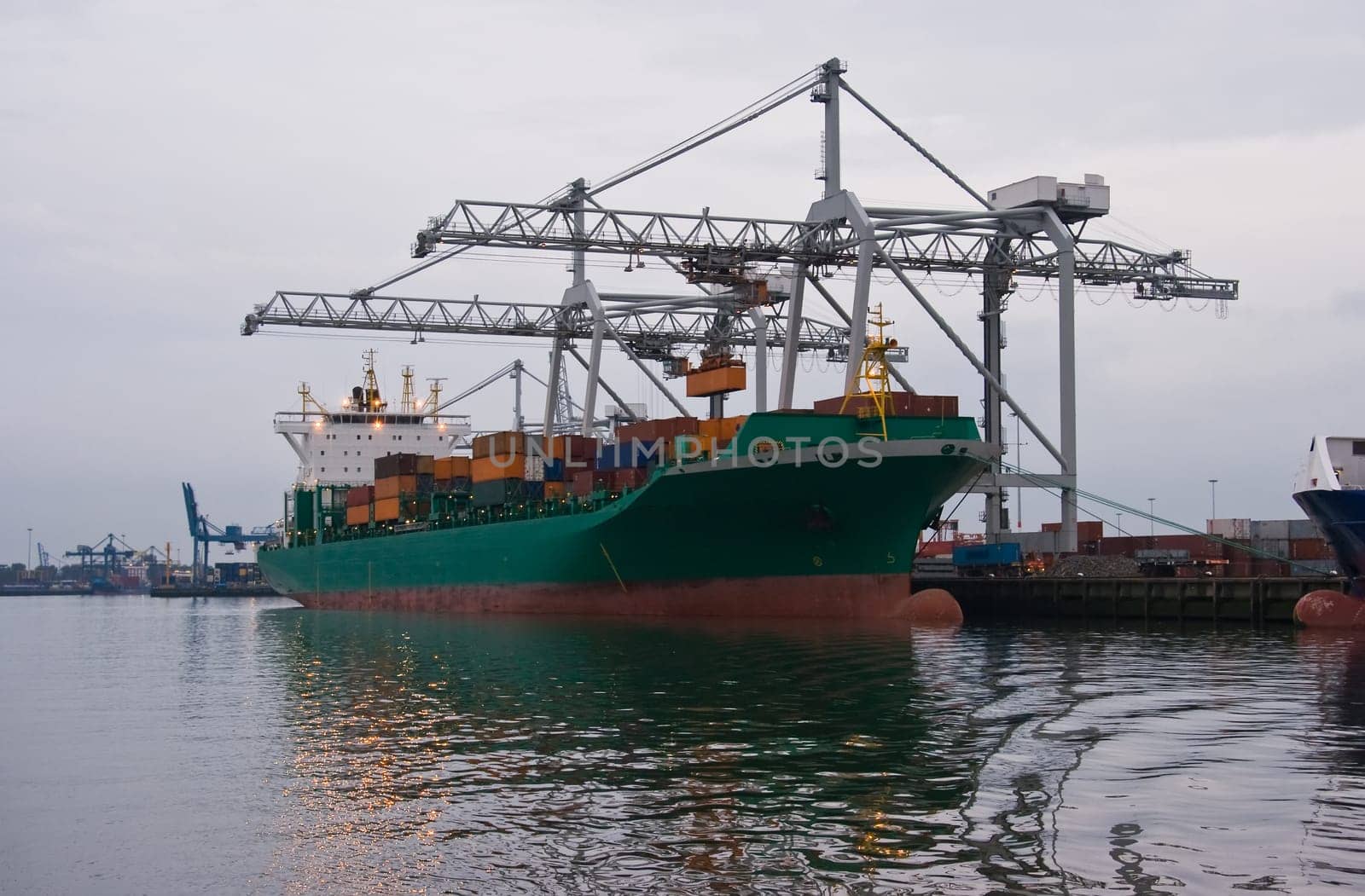 Containership in port on cloudy evening