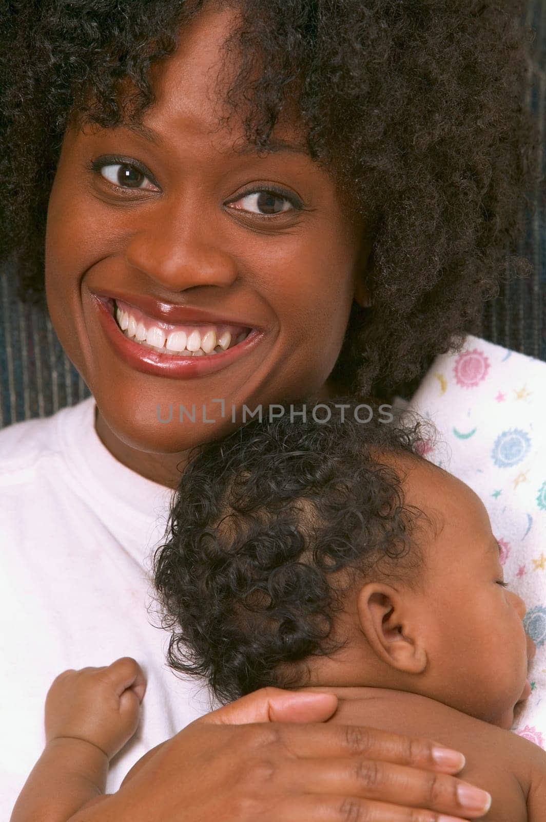 Mother holding sleeping baby