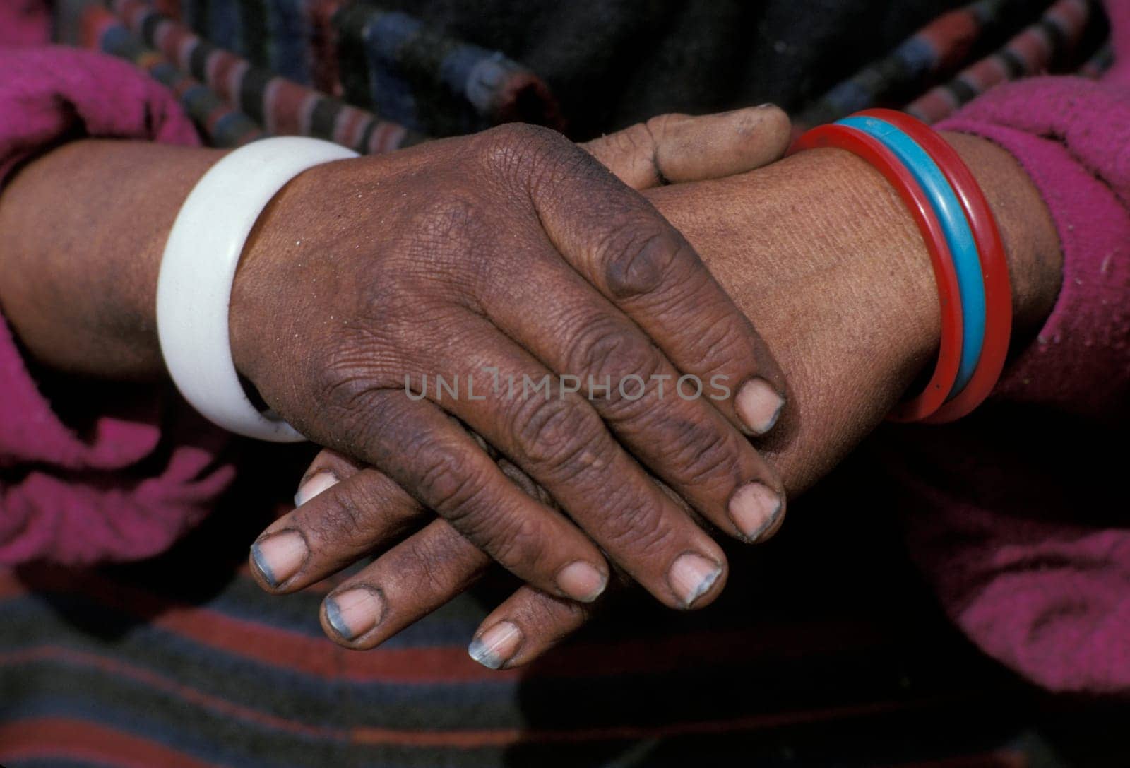 Ethnic hands folded