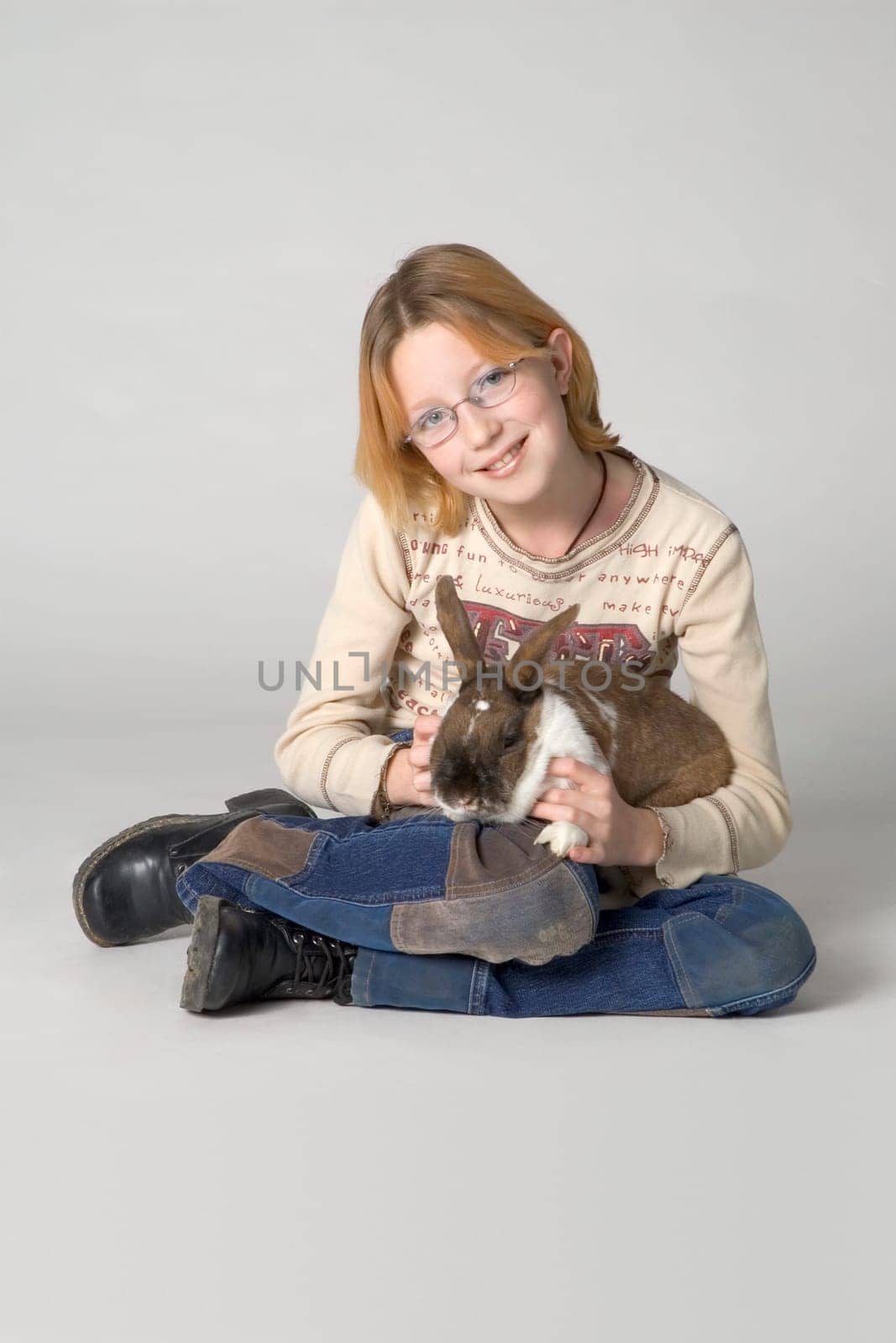 Young girl with pet rabbit