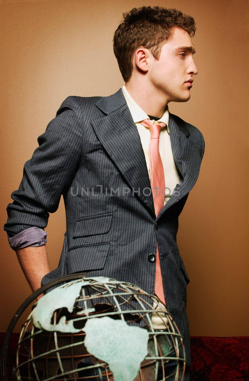 Young man with globe