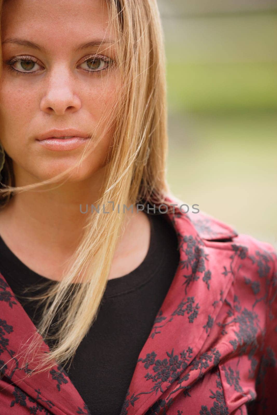 Blonde wearing red and black jacket
