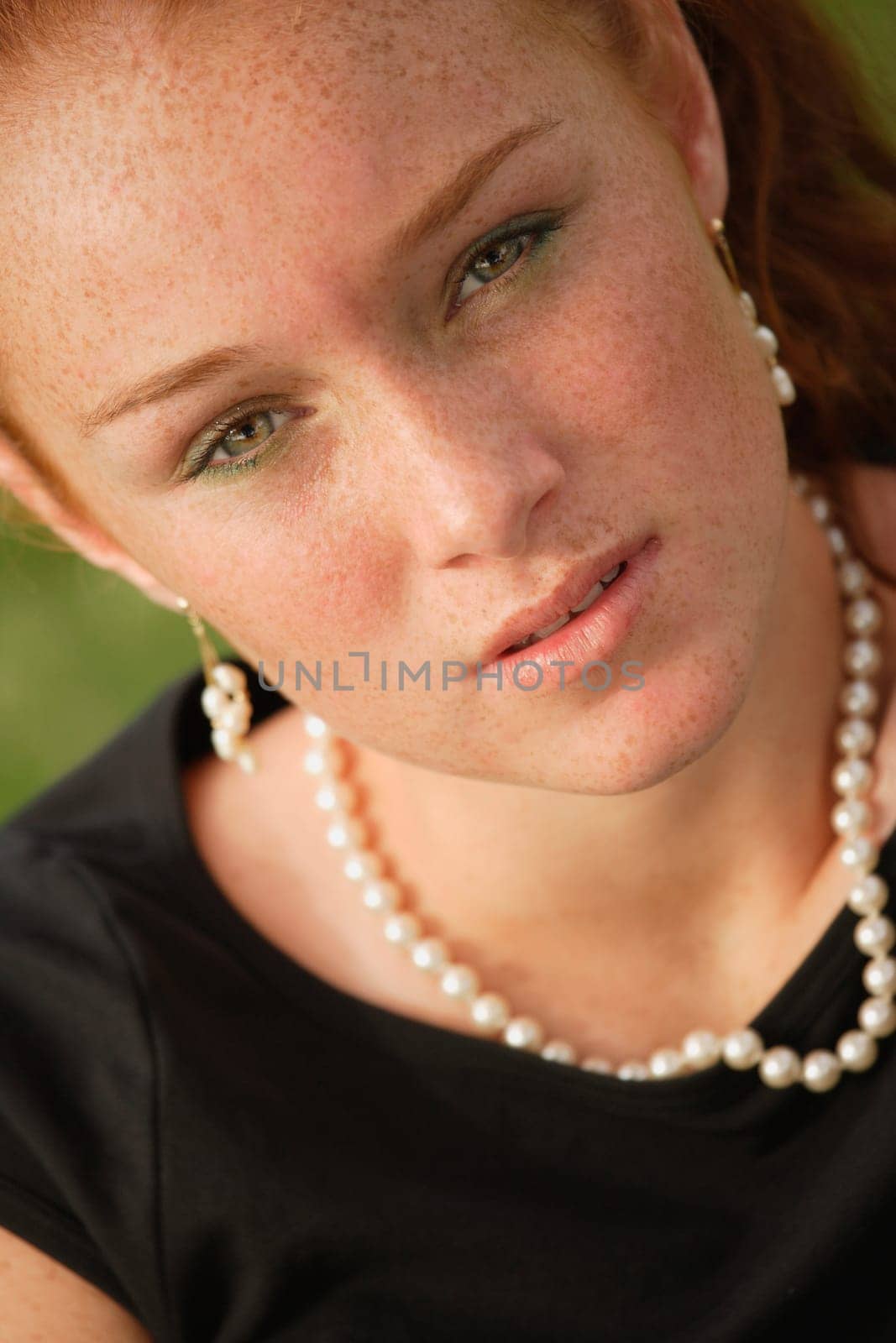 Pretty teenage girl with red hair