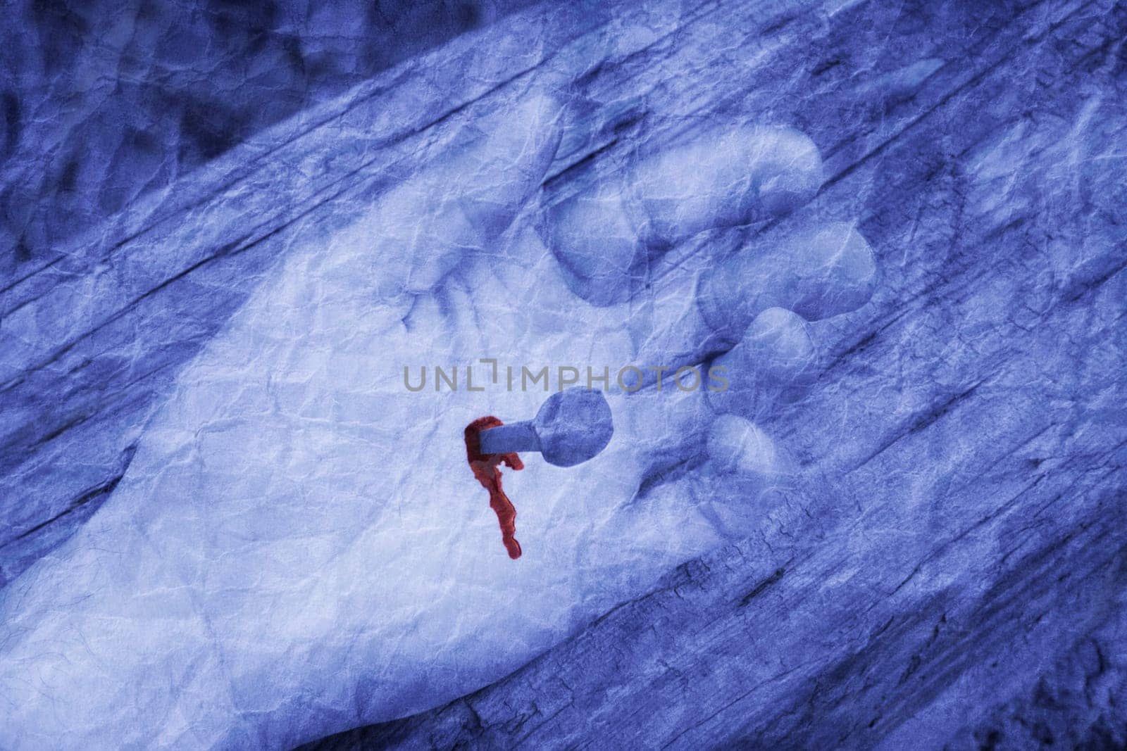 Nail in palm of hand