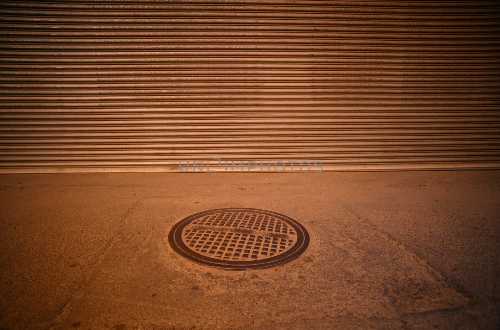 Manhole cover on the sidewalk