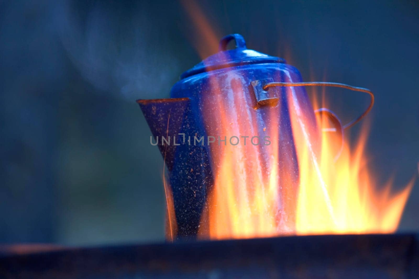 Camping kettle over fire
