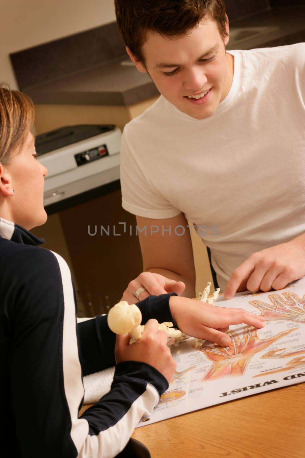Physiotherapist explaining anatomy to a student