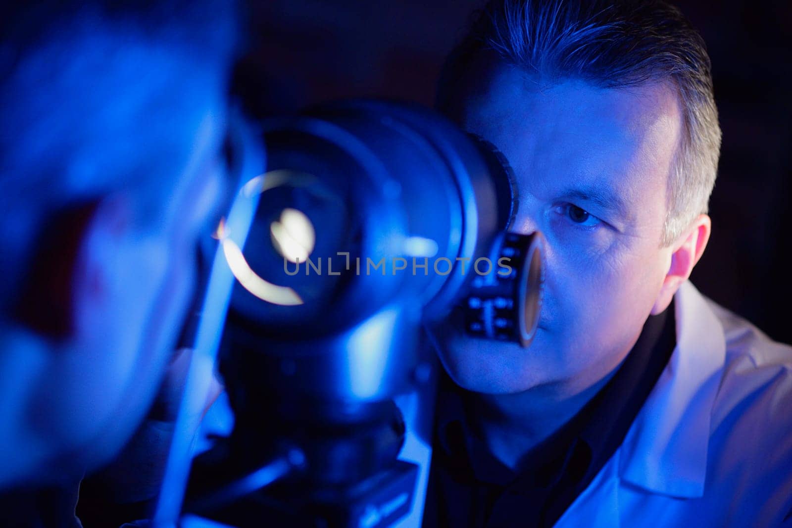 Optometrist administering an eye exam