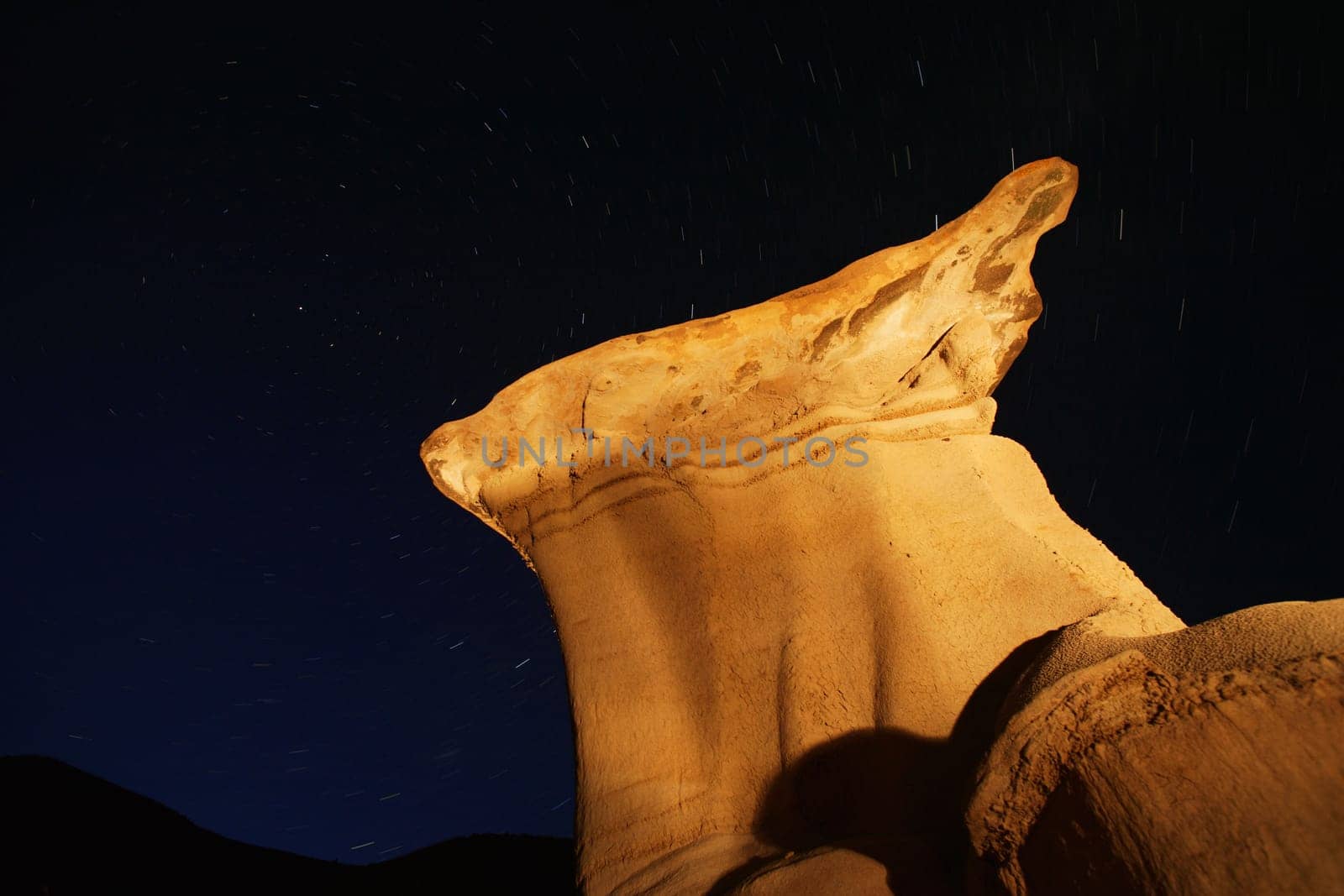 Rock formation against a night sky