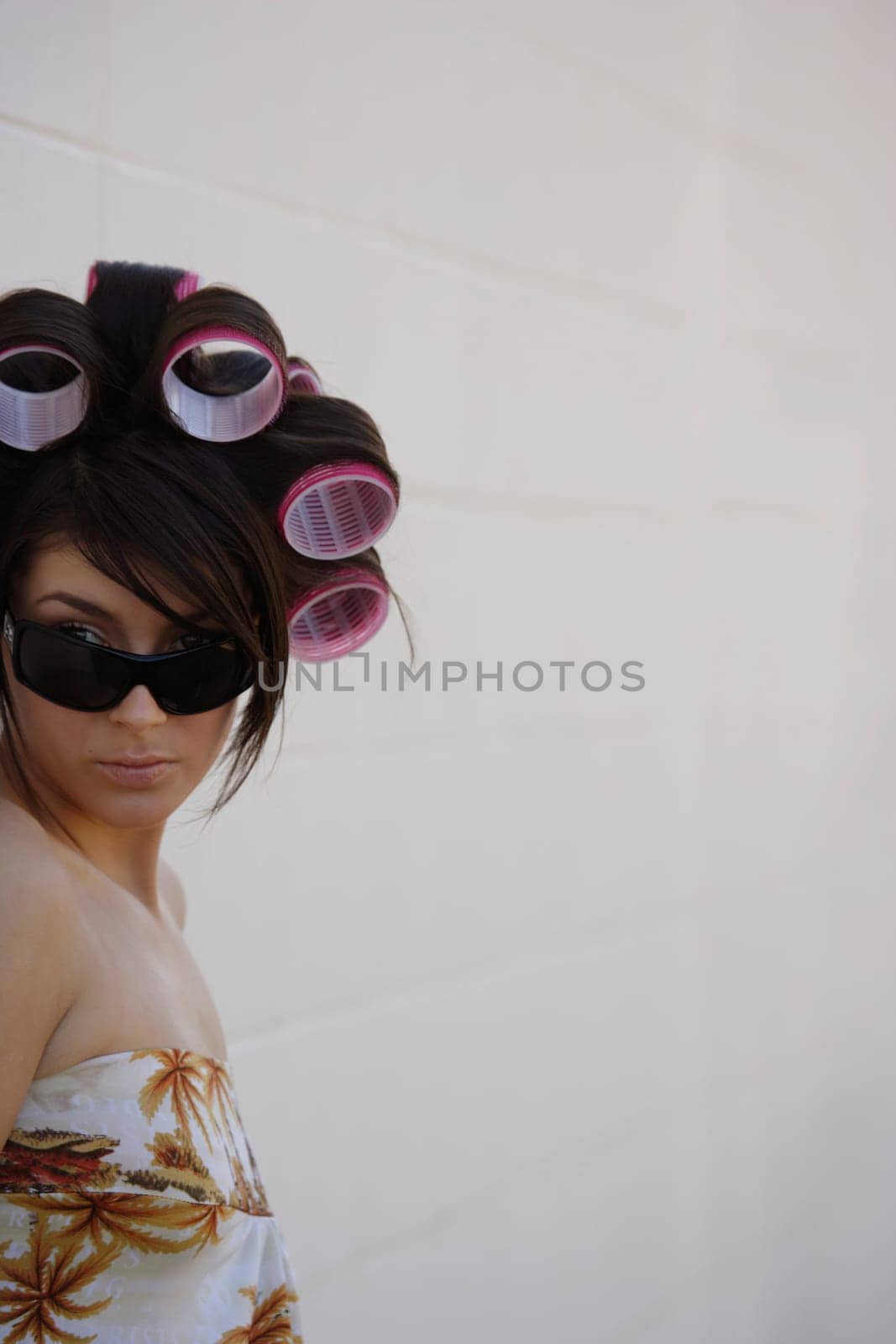 A woman with curlers in her hair