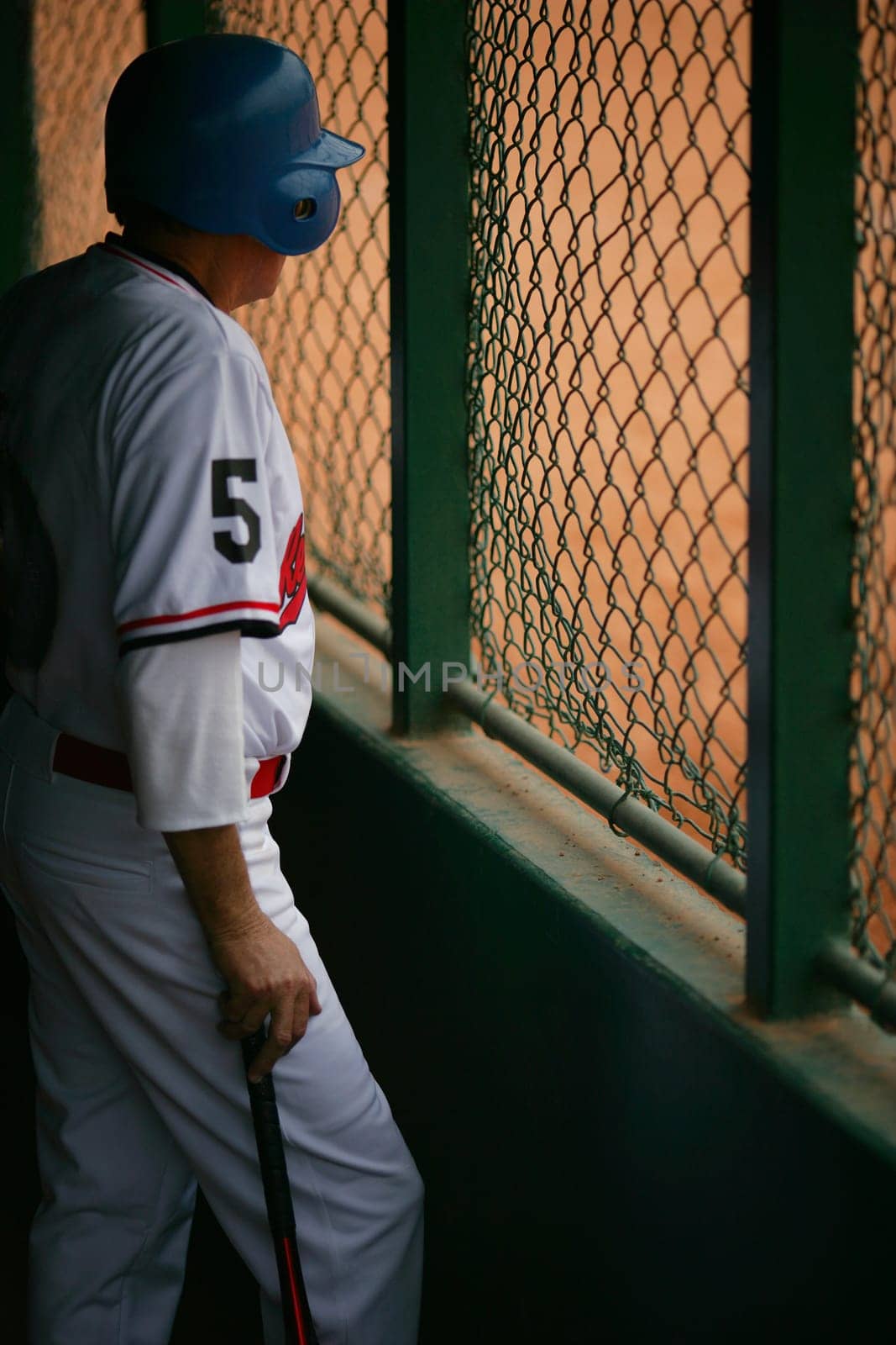 Baseball player in dugout