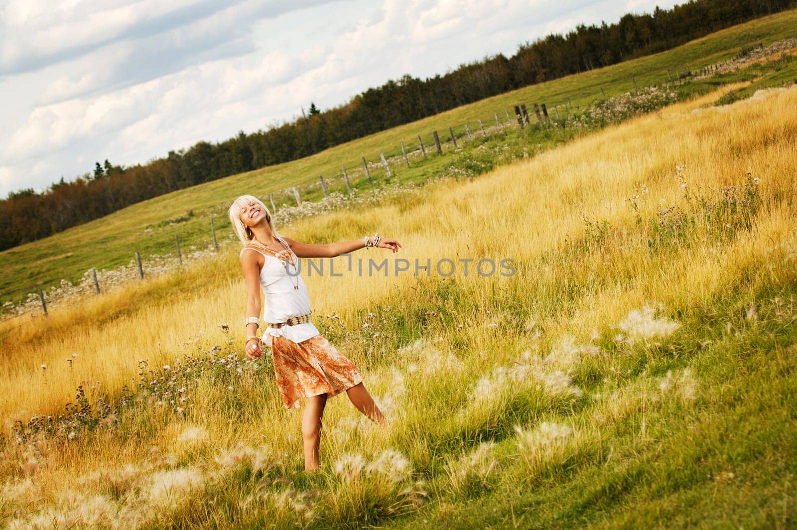 Teen girl walking through field