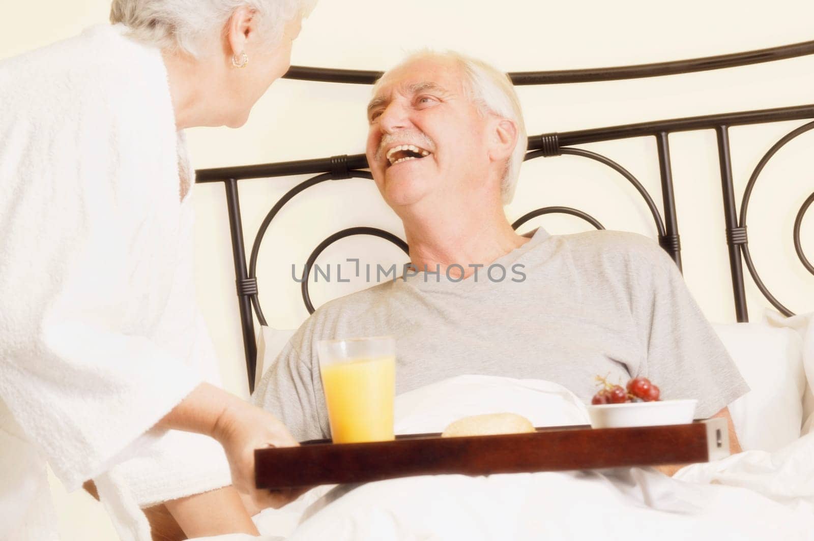 Man has breakfast in bed