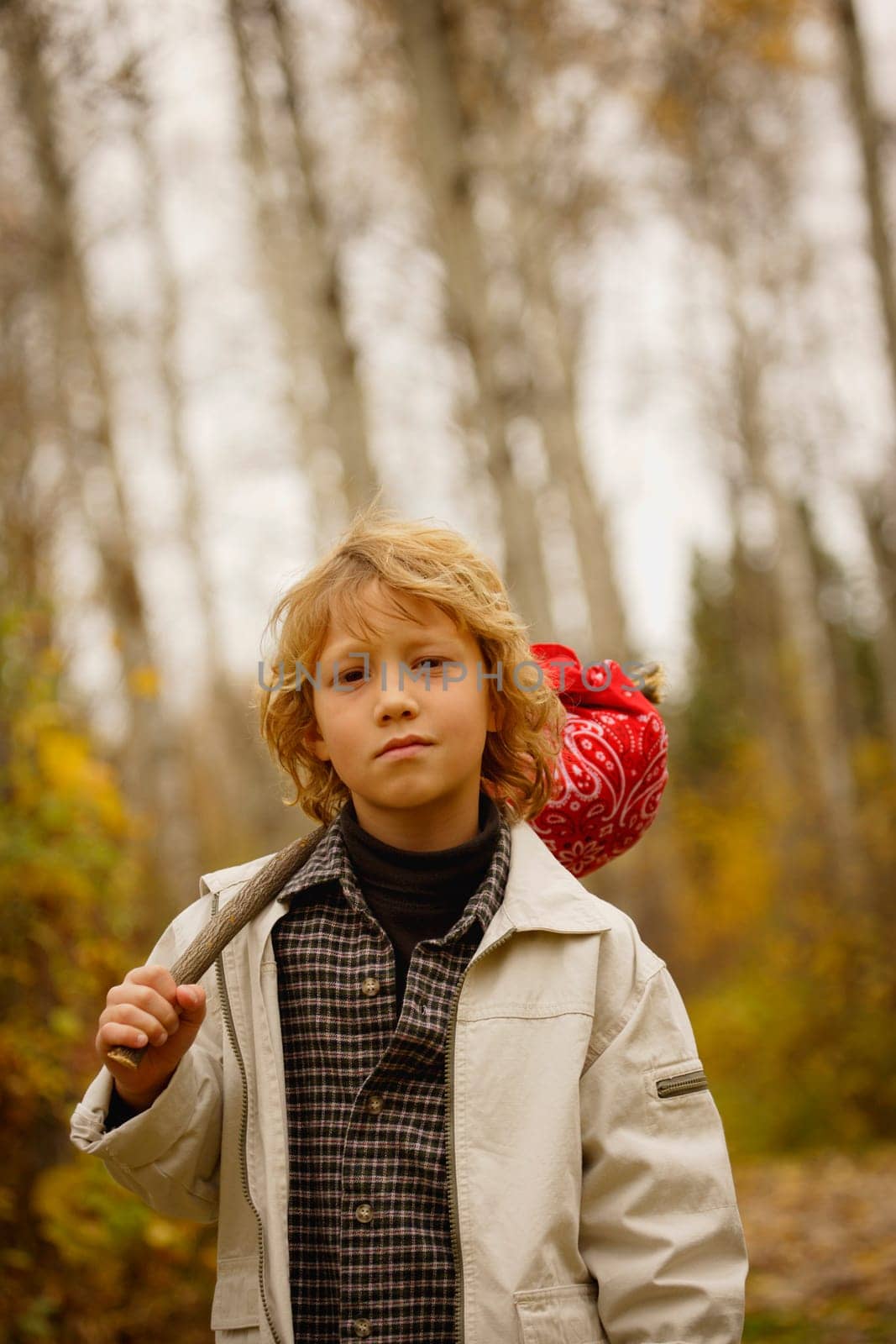 Young boy walking with pack