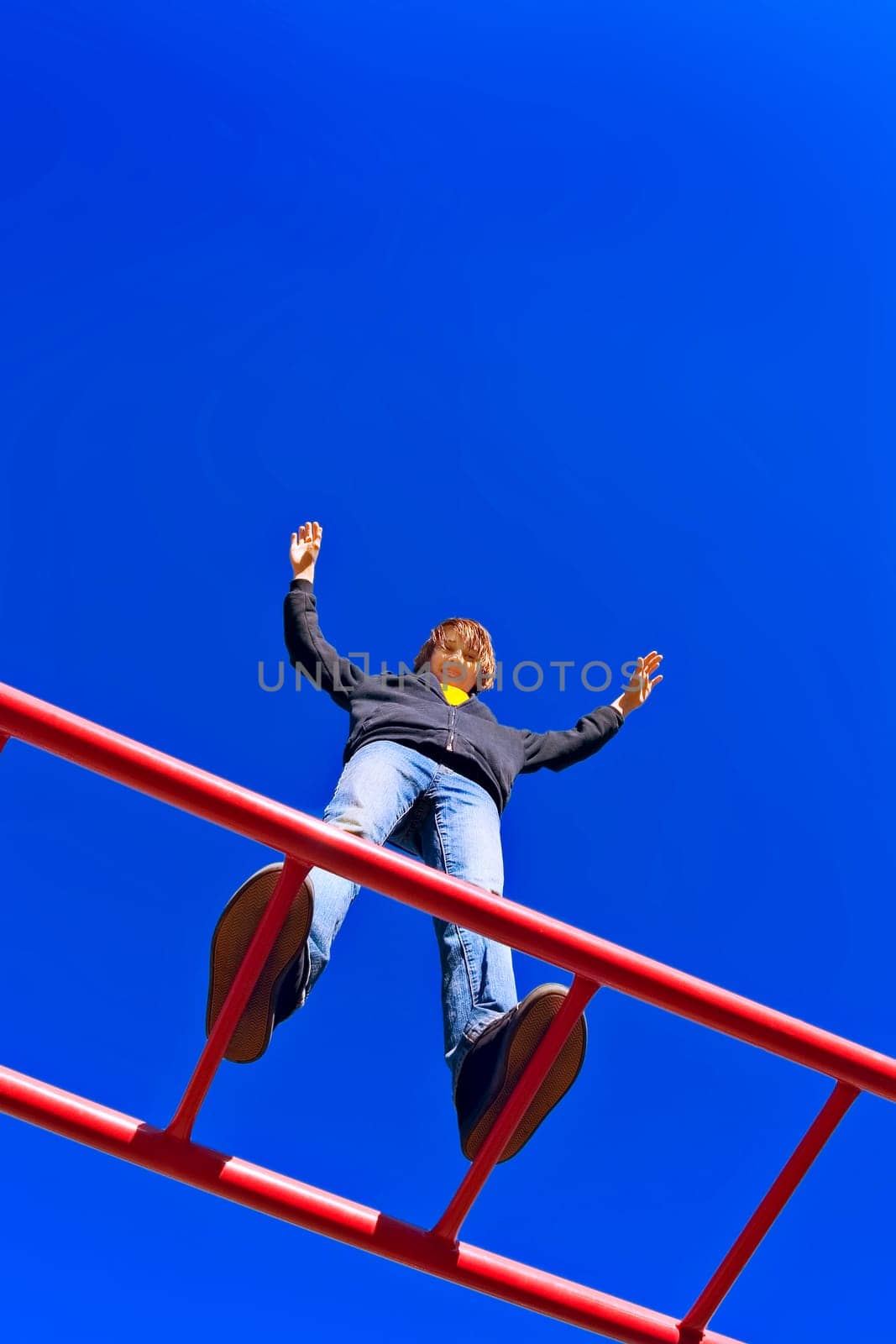 Child stands tall at playground