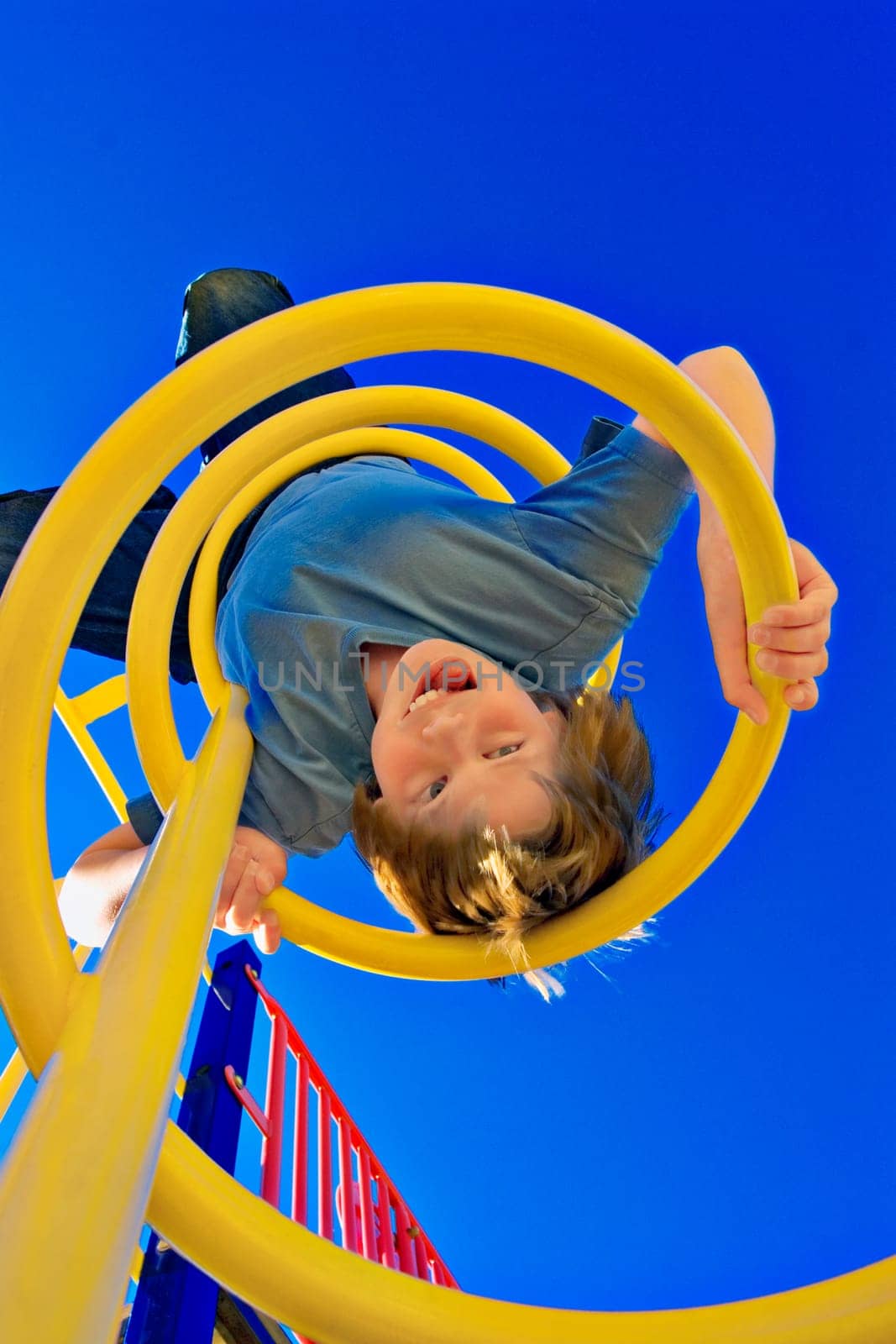 Child hangs on upside down