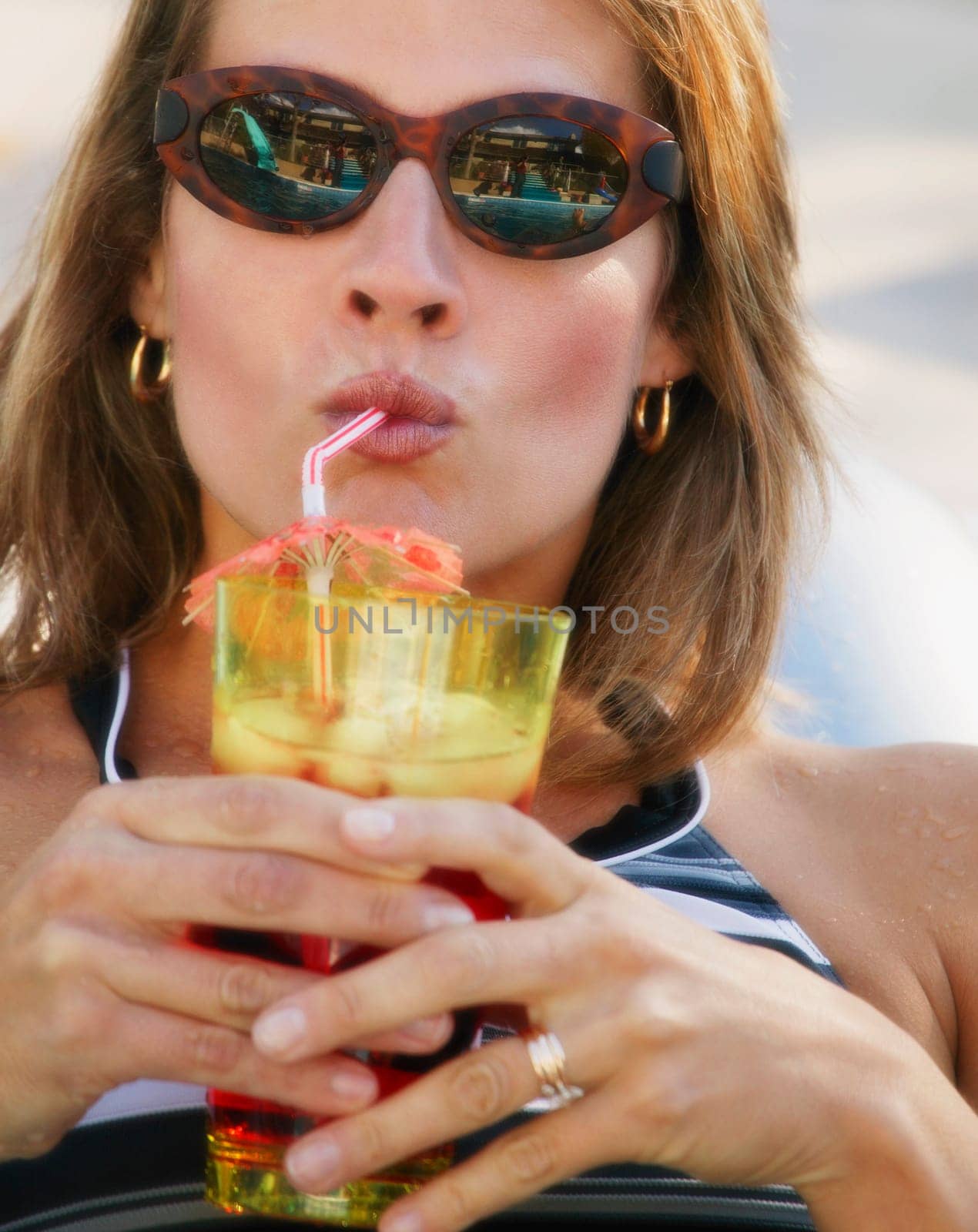 Woman drinks a refreshing beverage