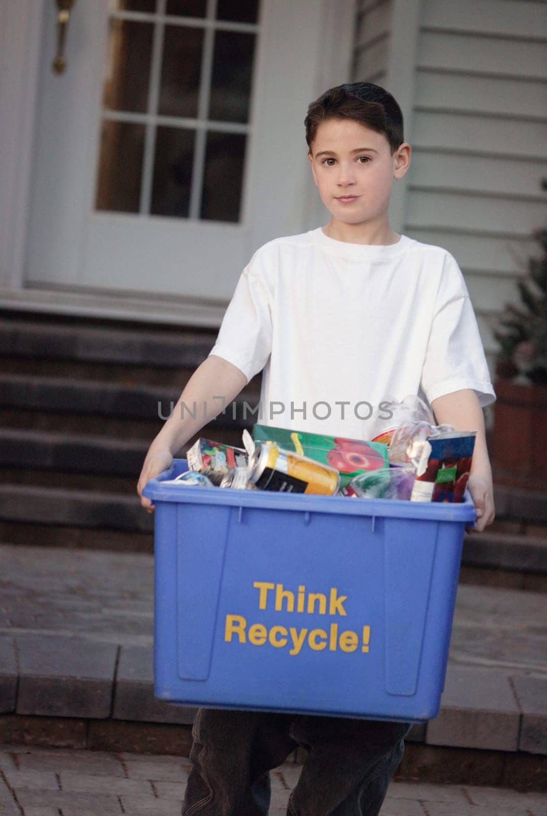 Young boy recycling