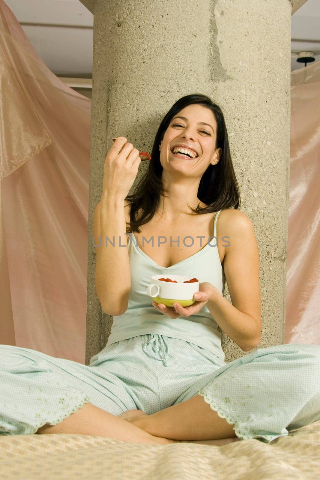 Woman eating strawberries