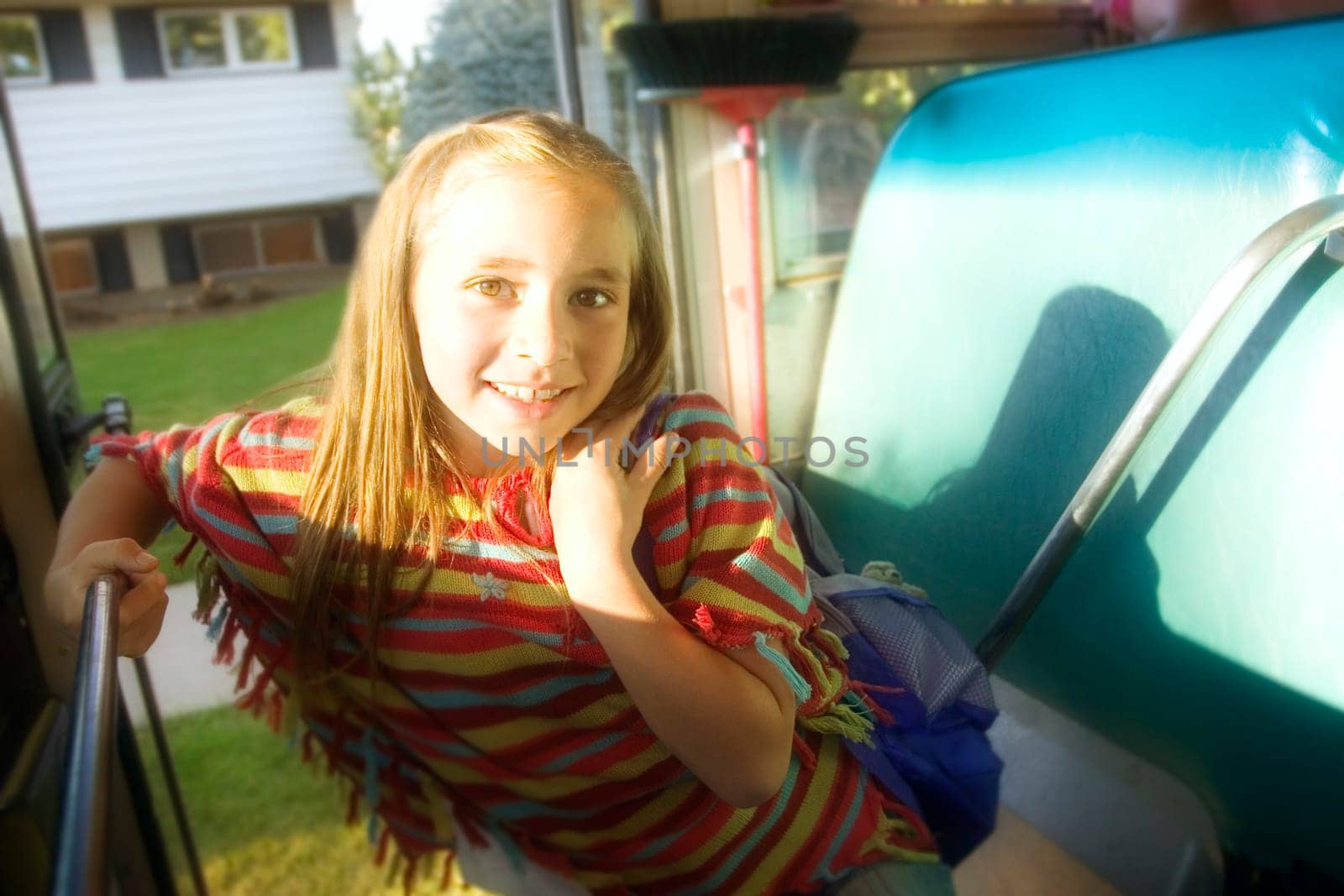Child getting on school bus
